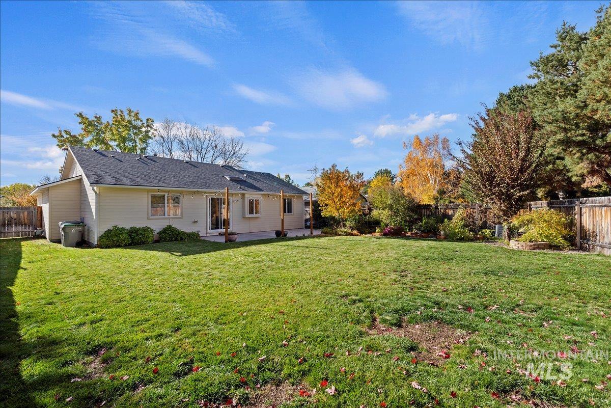 Fenced backyard featuring a patio area