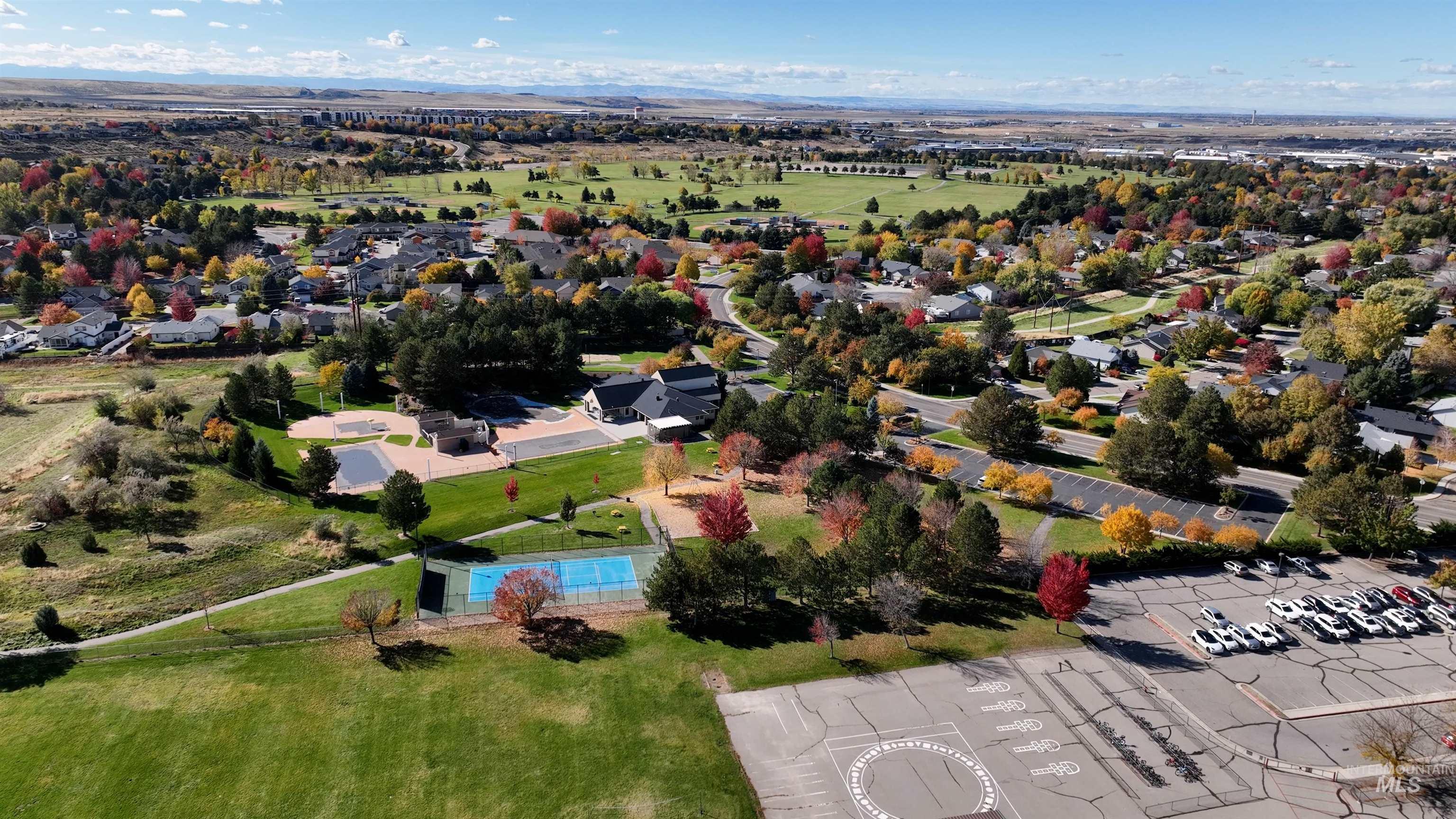 Aerial view of residential area featuring a pool area