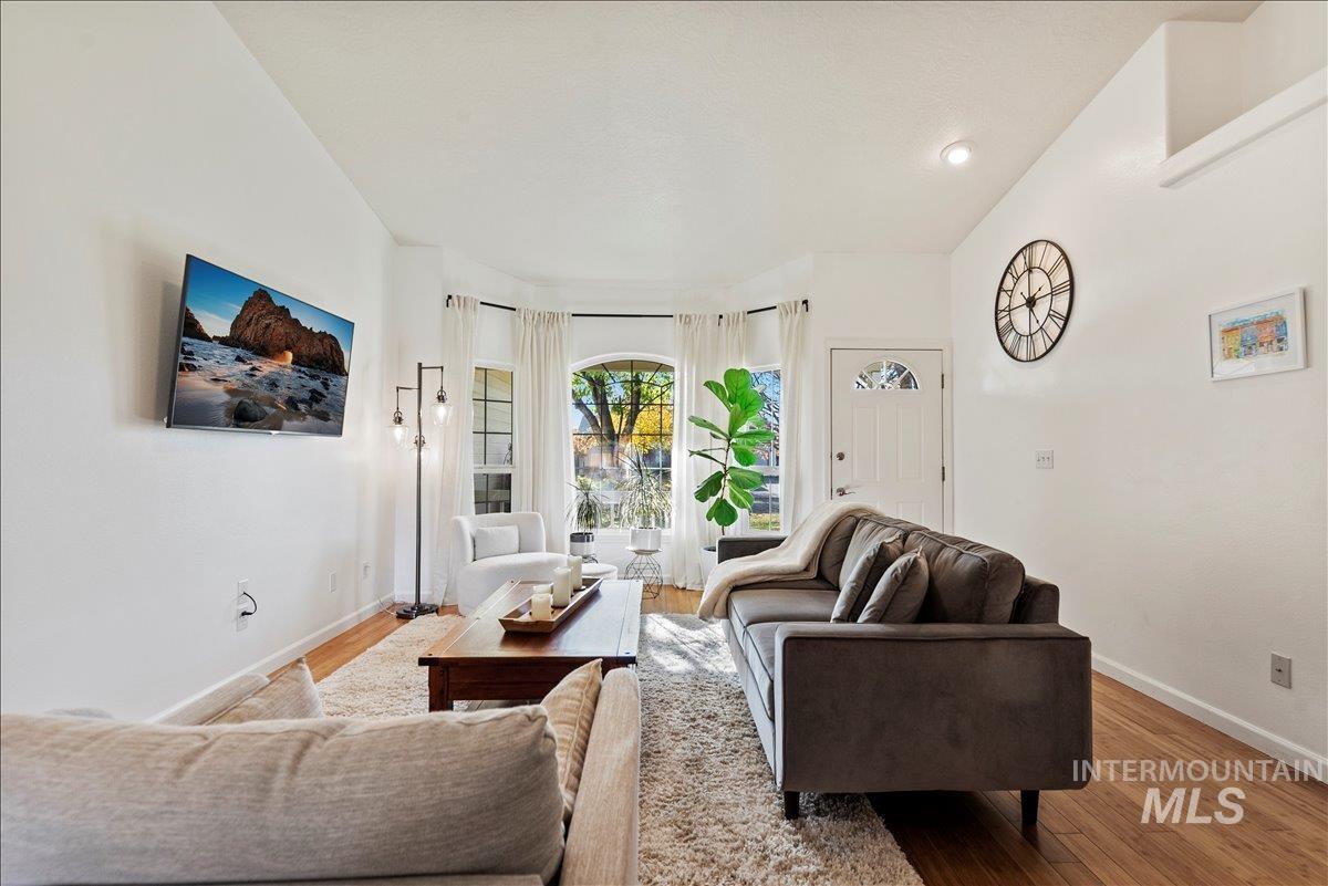 Living area featuring wood finished floors and baseboards