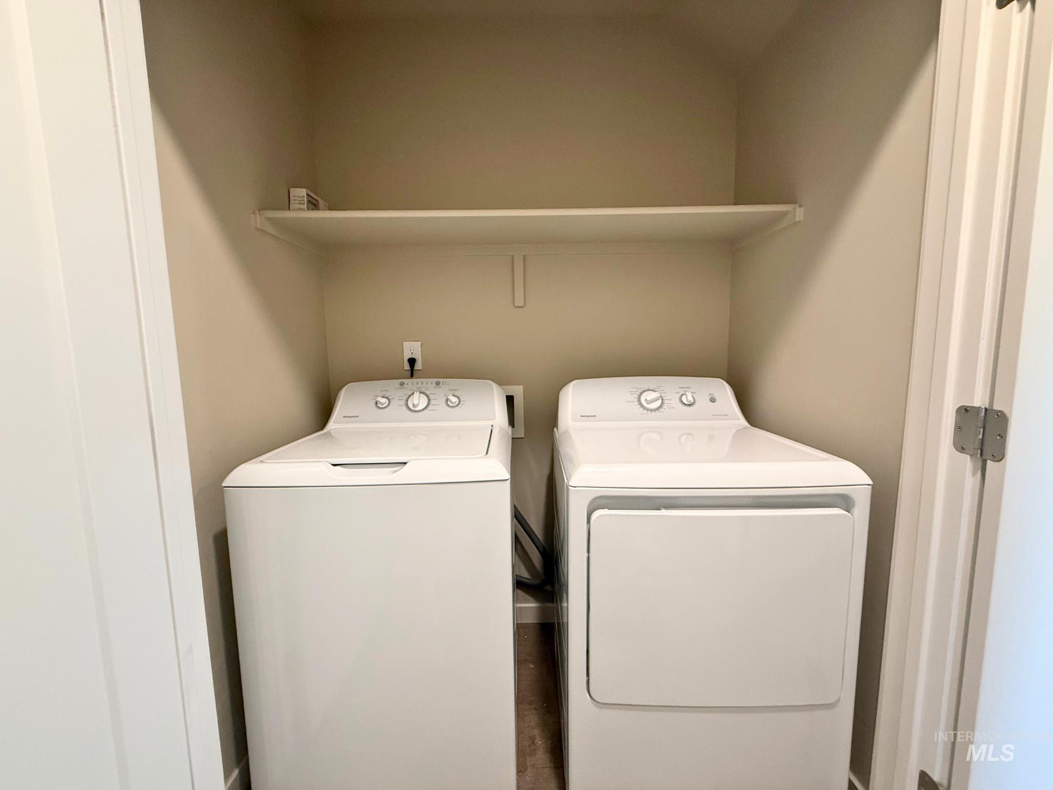 Laundry area featuring separate washer and dryer