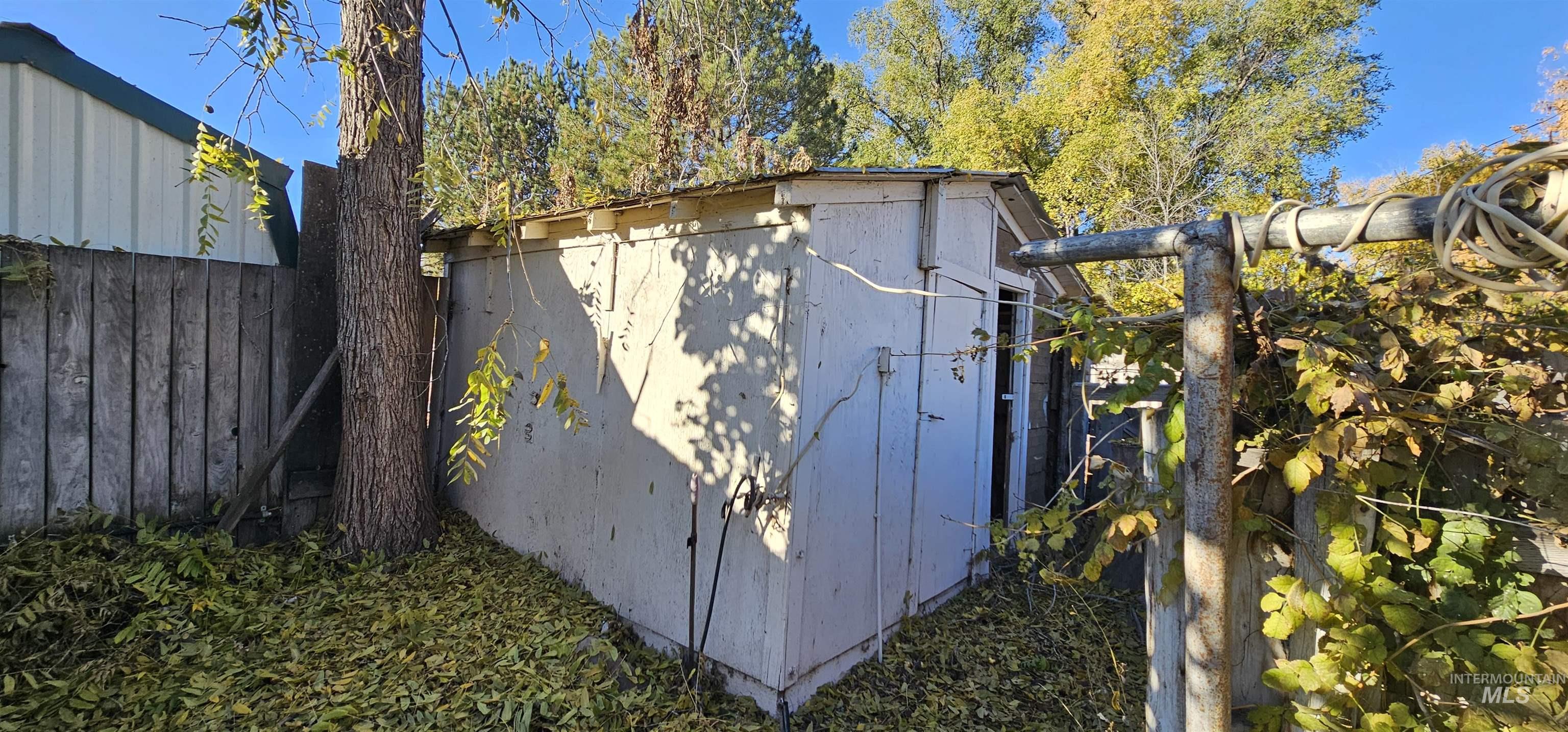 View of shed featuring a fenced backyard
