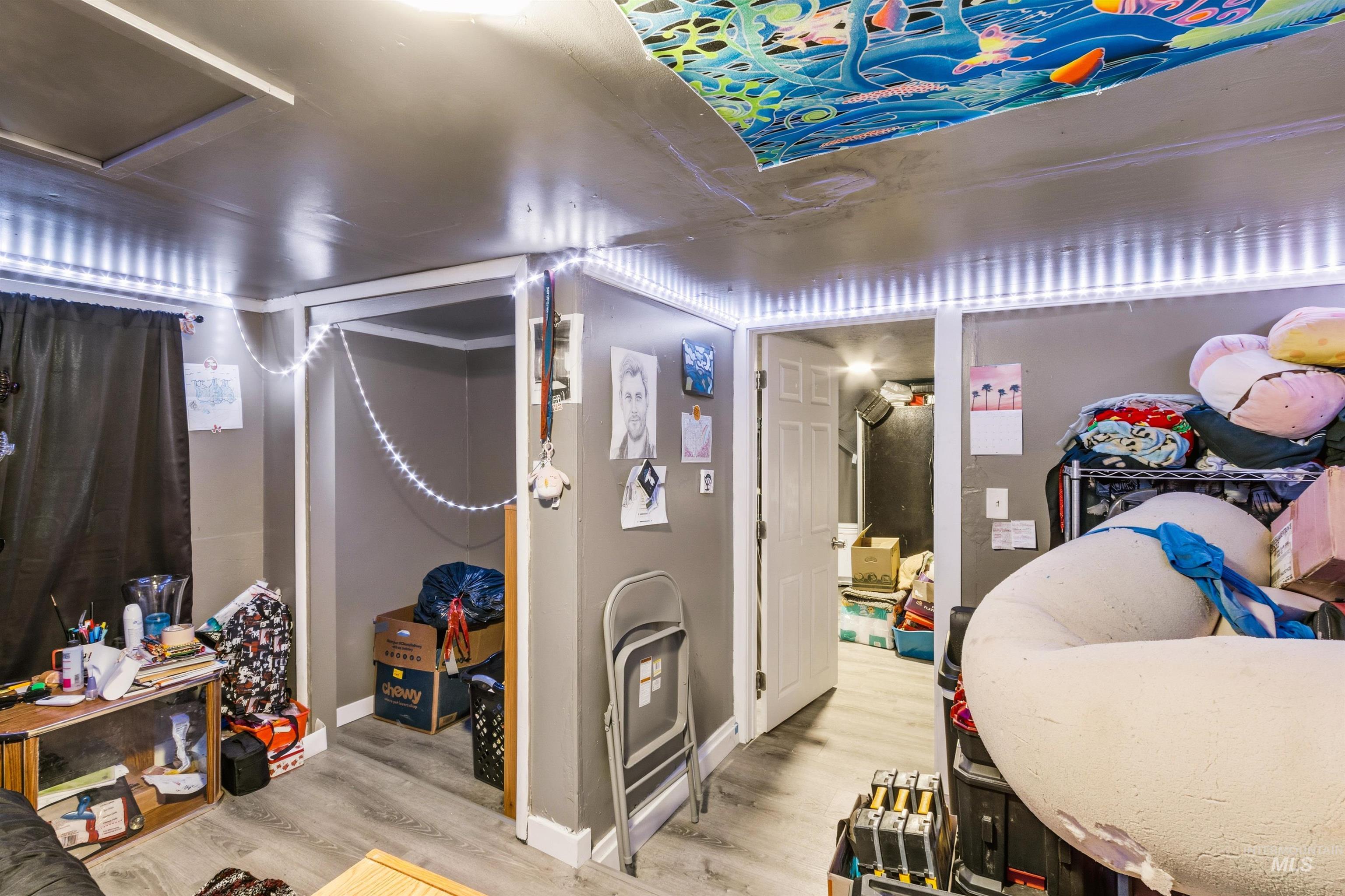 Interior space with wood finished floors and baseboards