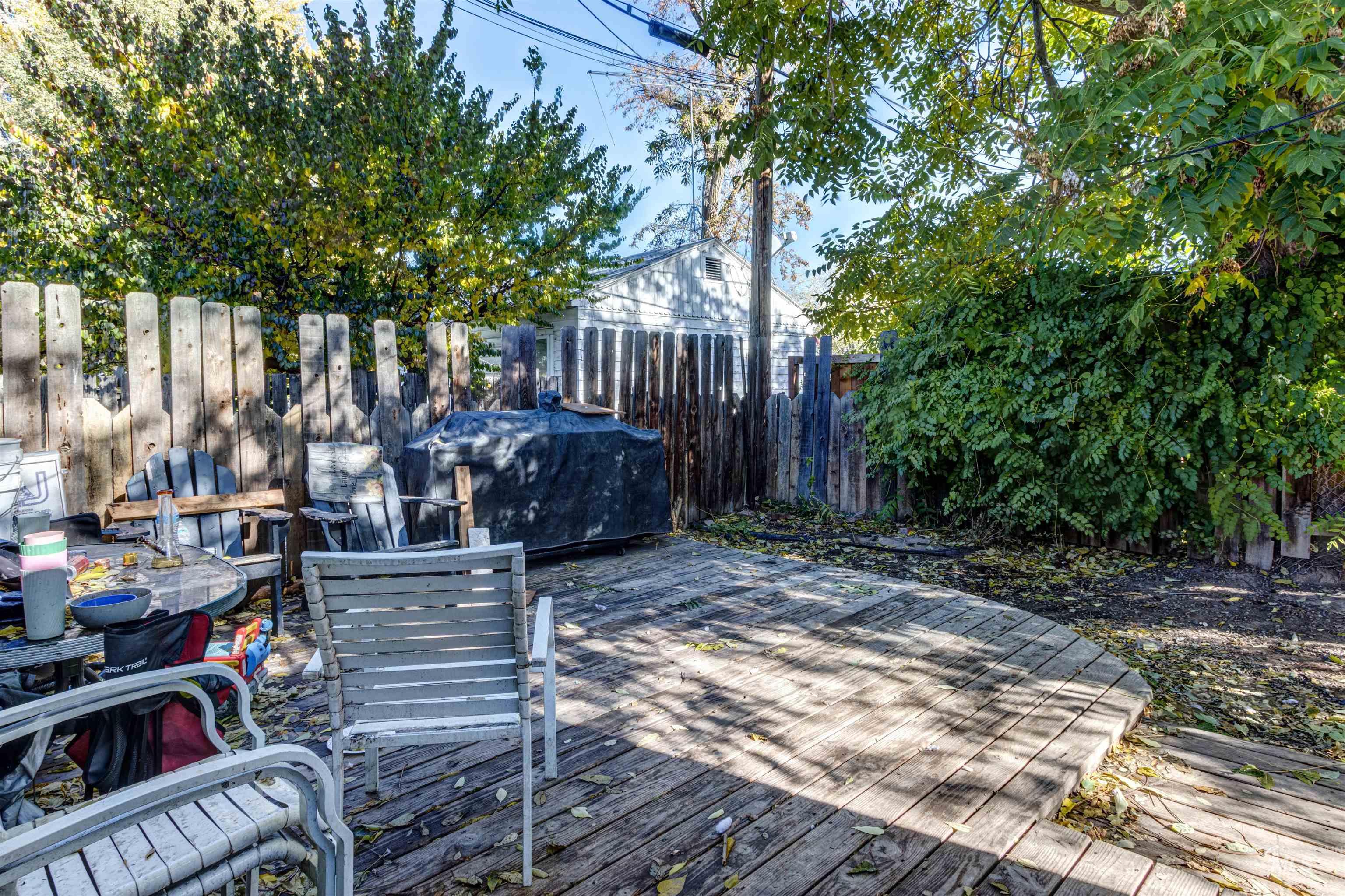 Deck with a fenced backyard