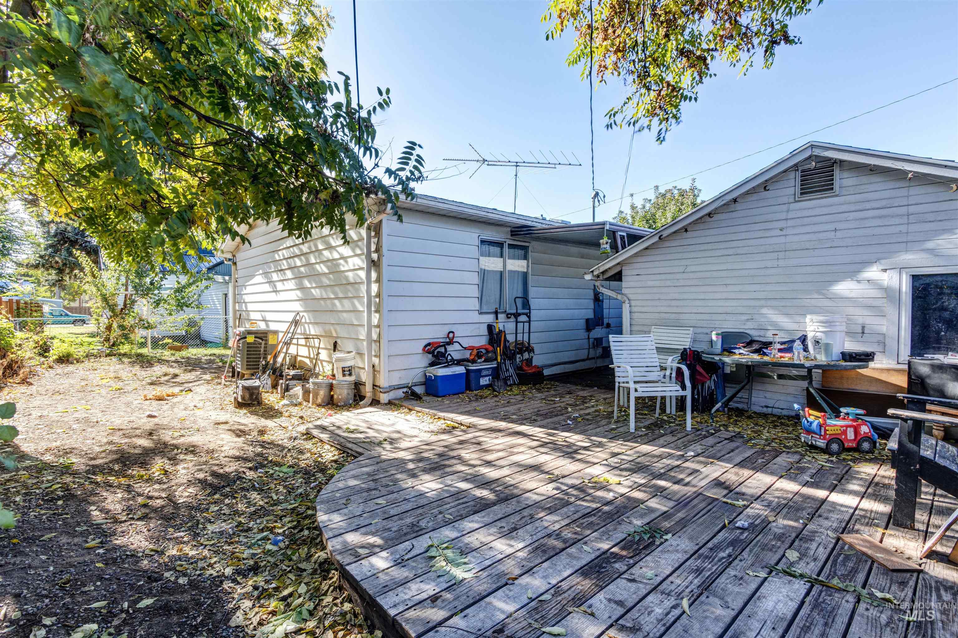 Rear view of property with a wooden deck