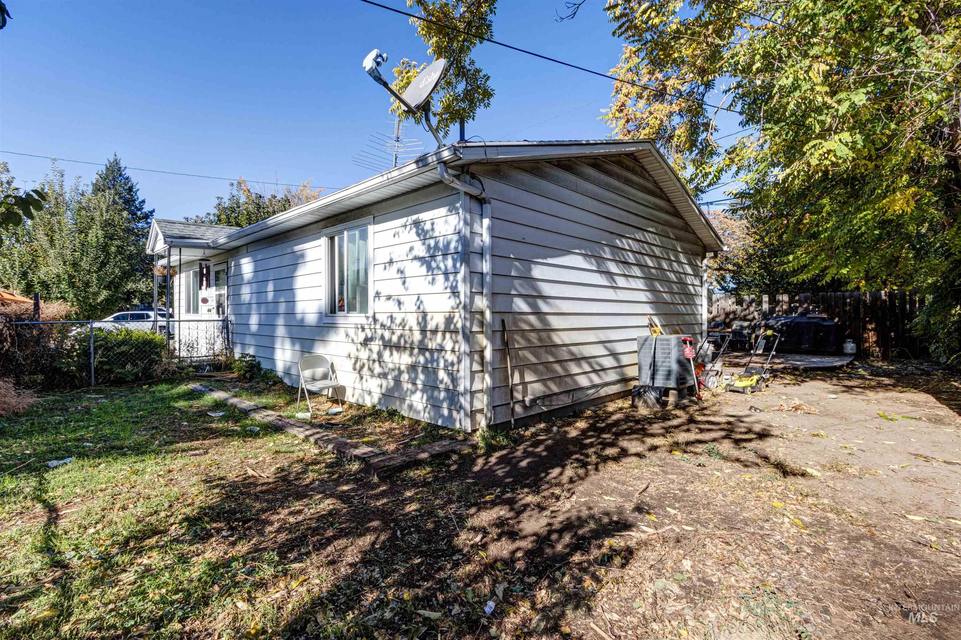 View of side of home featuring a central air condition unit
