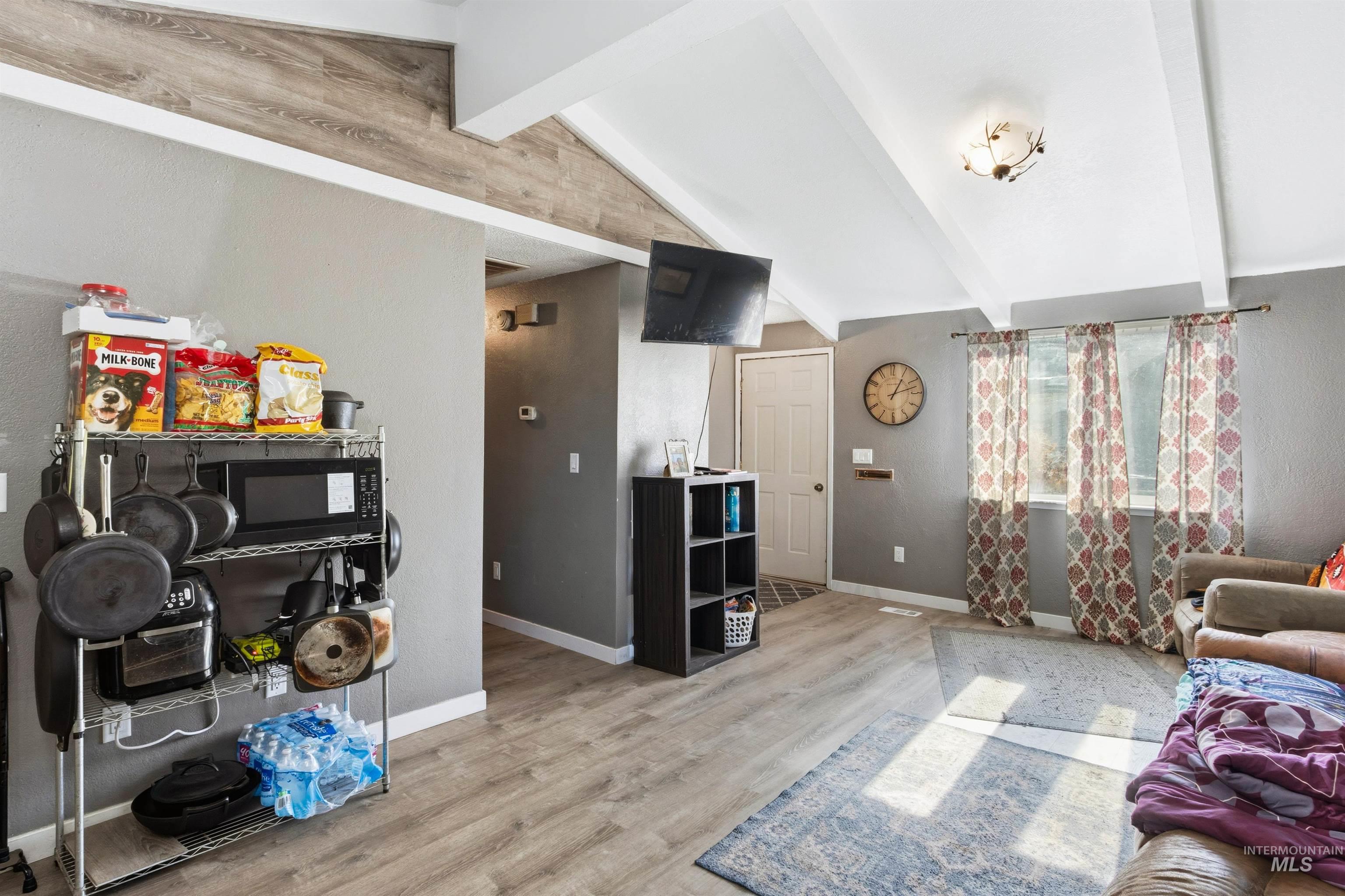 Living room featuring wood finished floors and baseboards