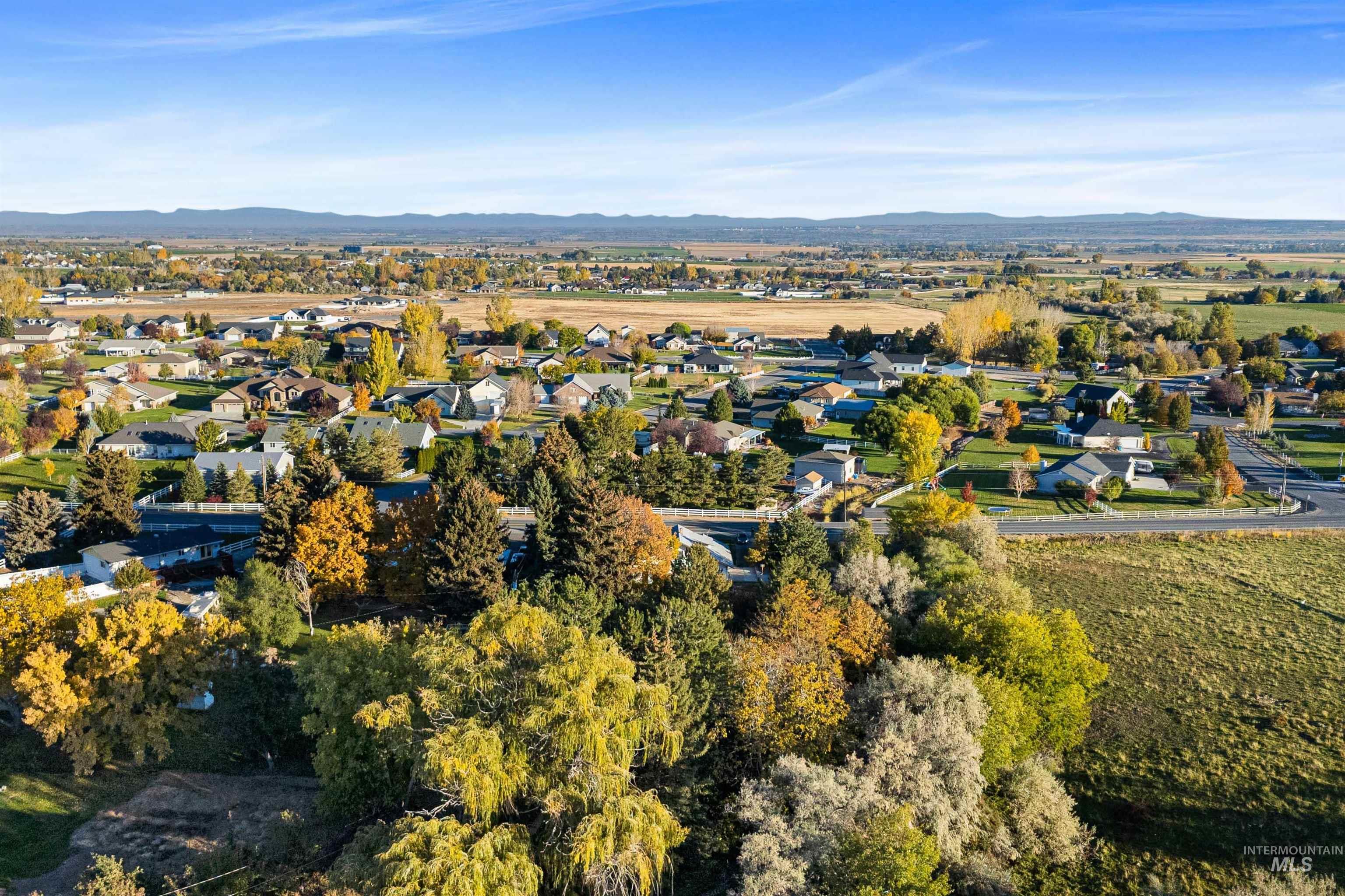 View of property location with nearby suburban area and a mountain backdrop