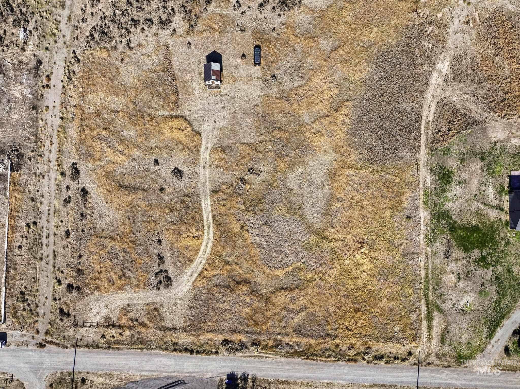 Aerial view of property and surrounding area with rural landscape