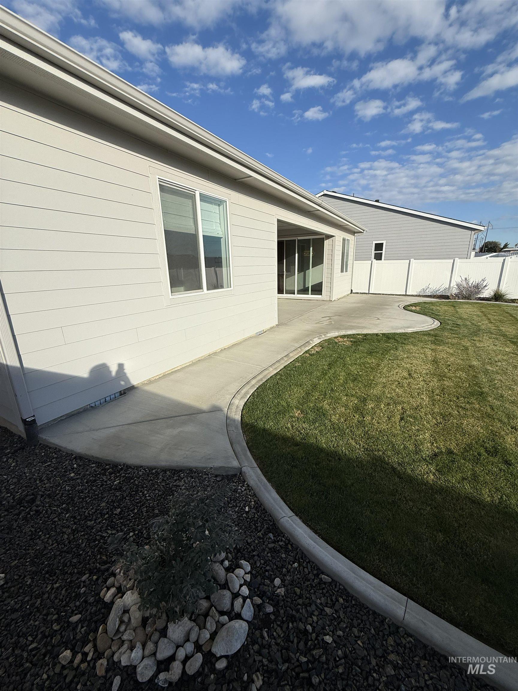 View of back yard featuring a patio area