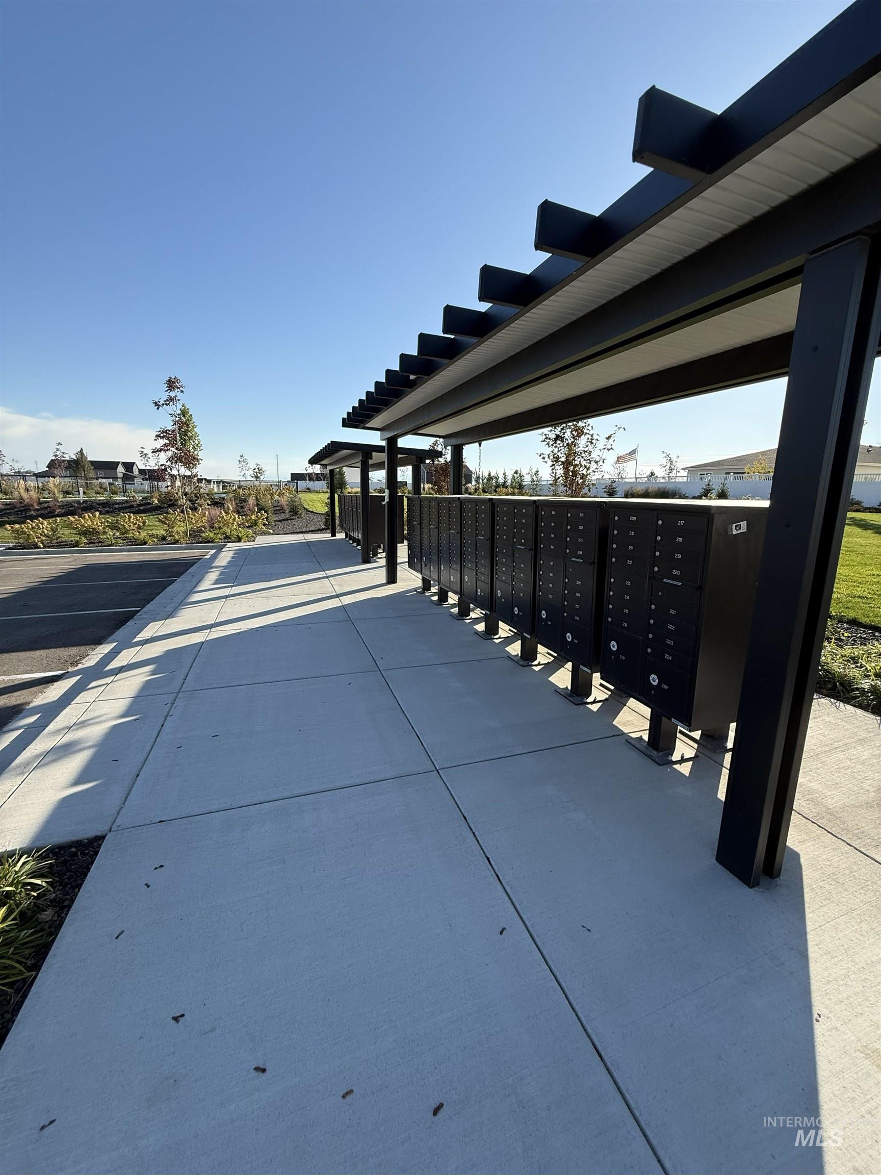 View of community with mail area and green belt