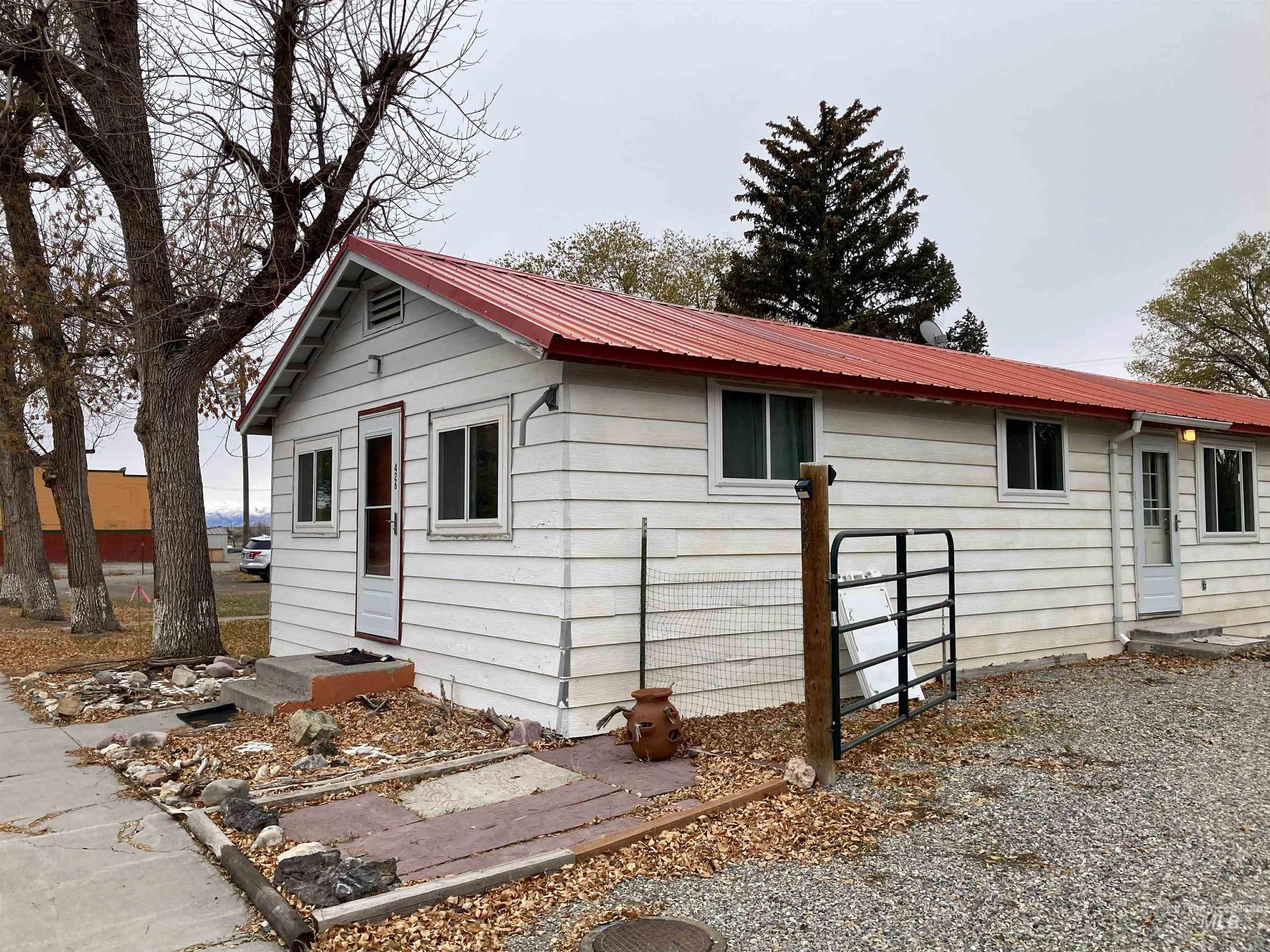 Ranch-style house featuring a metal roof
