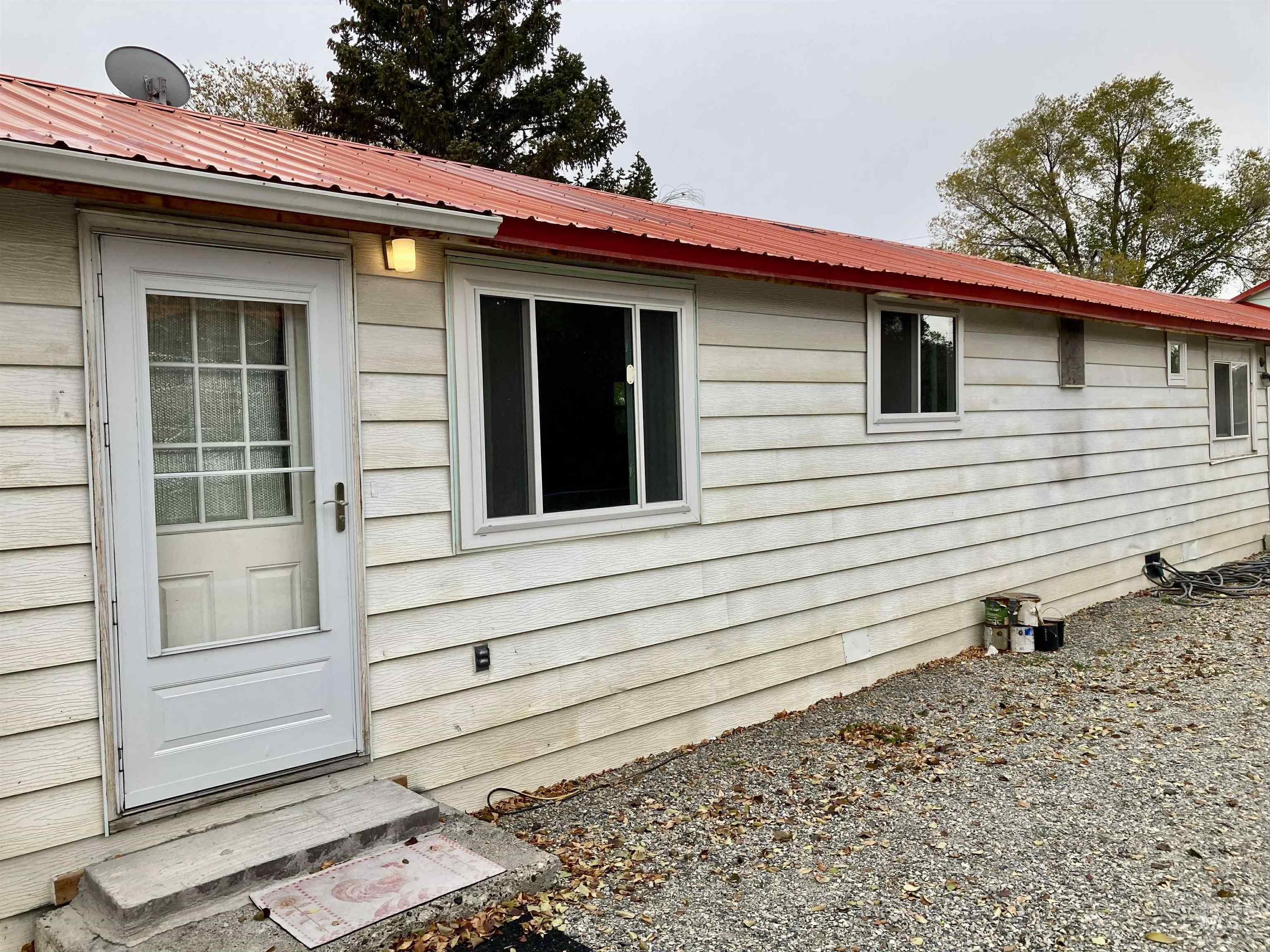 View of home's exterior featuring a metal roof