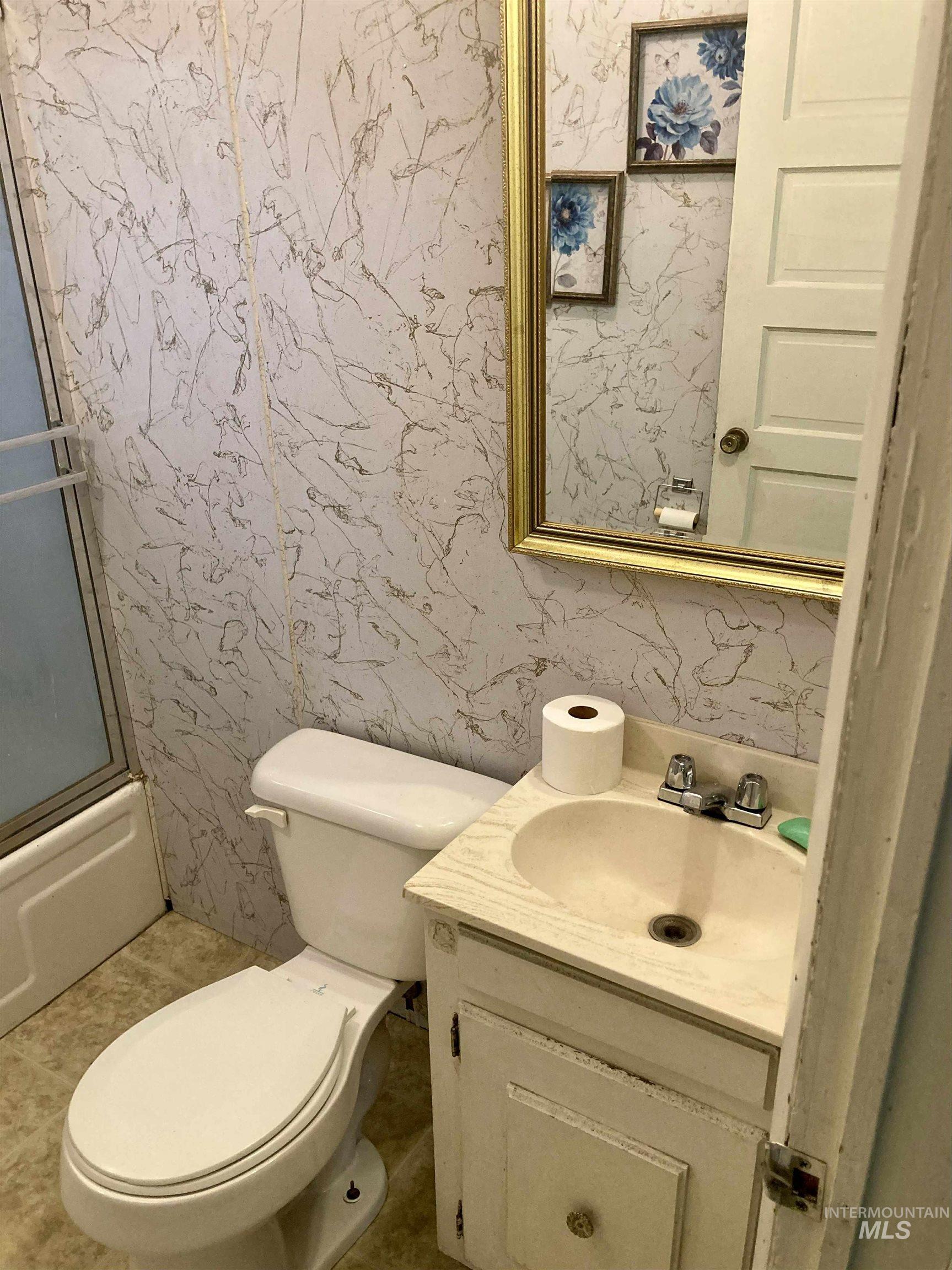 Full bathroom with vanity and toilet