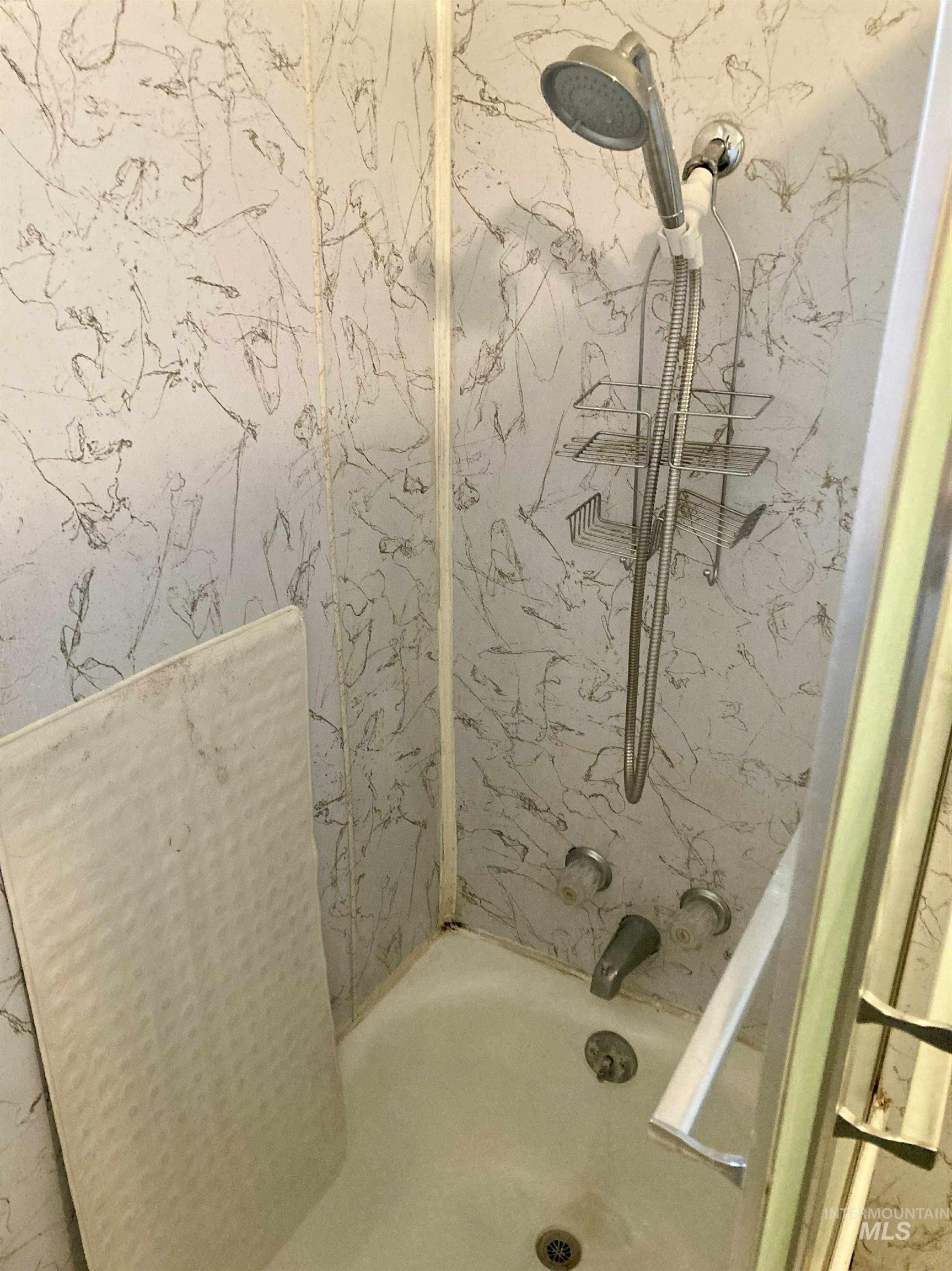 Bathroom featuring bathtub / shower combination