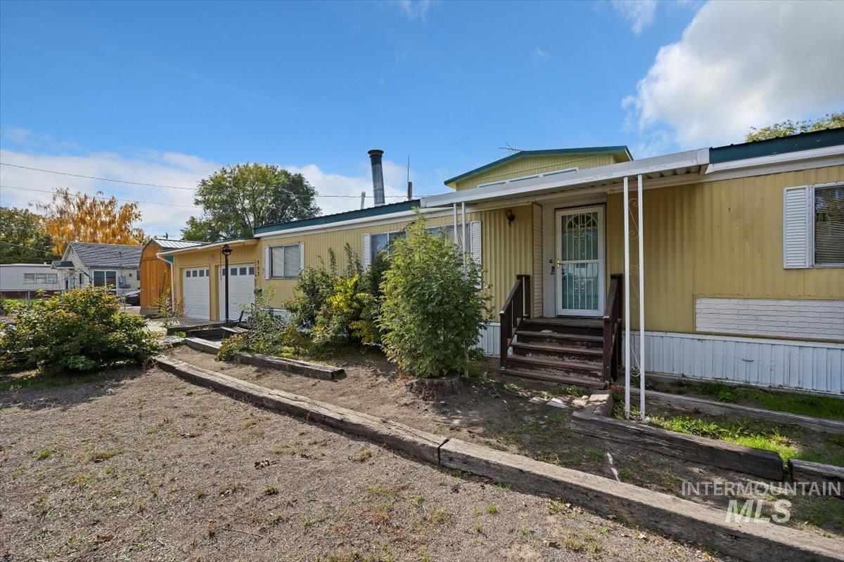 Back of house featuring a garage