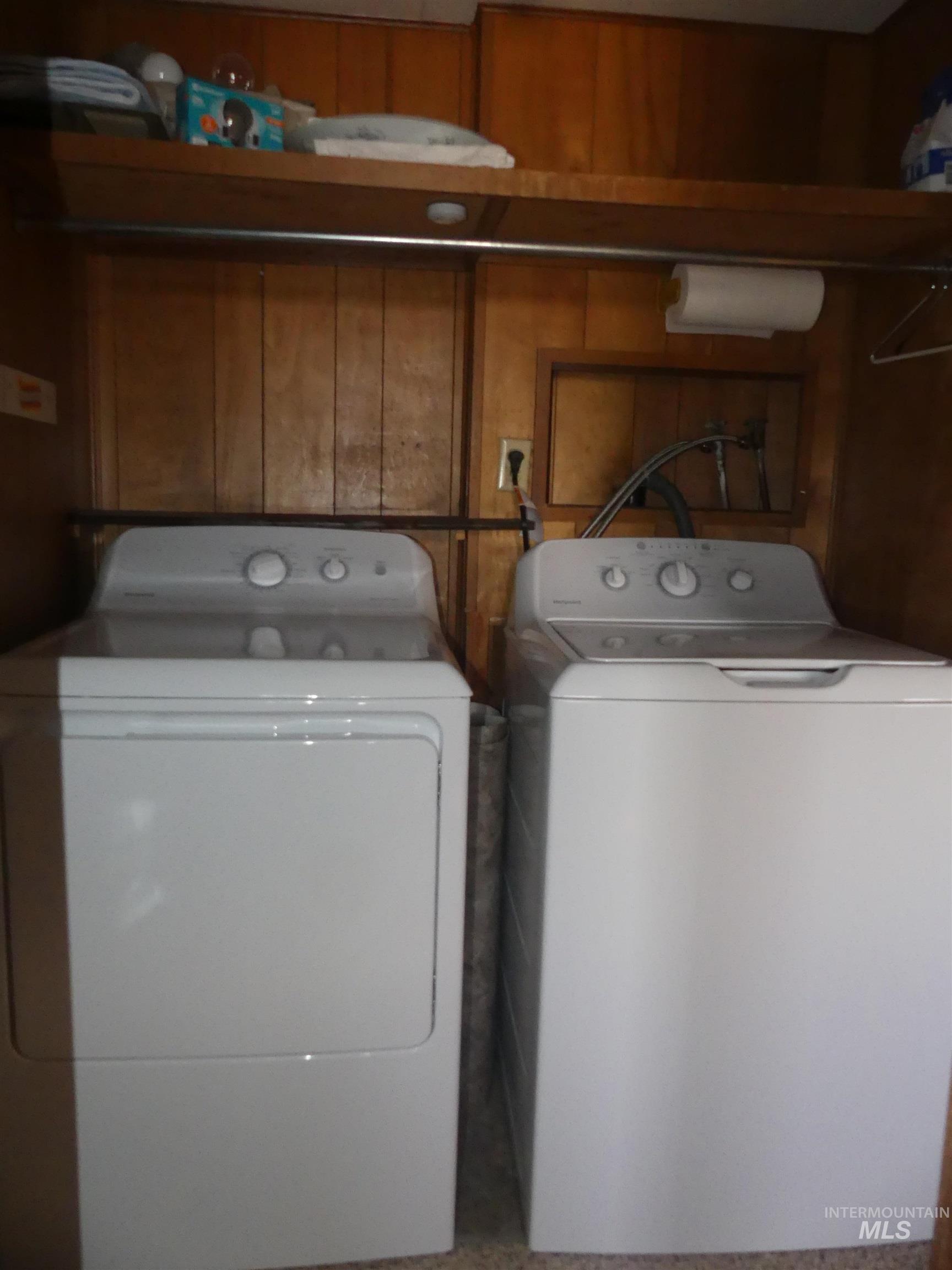 Laundry room with washing machine and clothes dryer