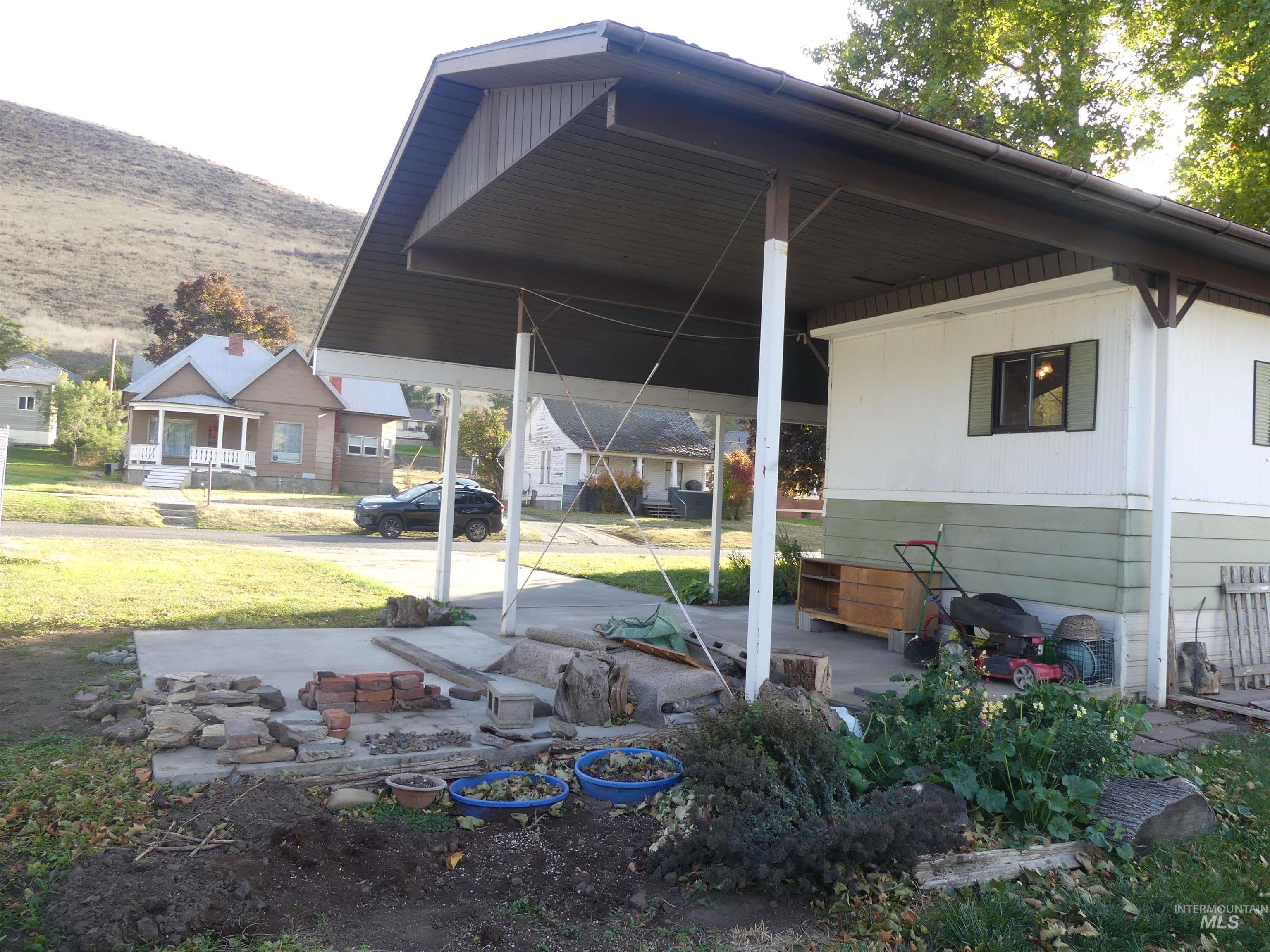 Porch featuring a lawn and a residential view
