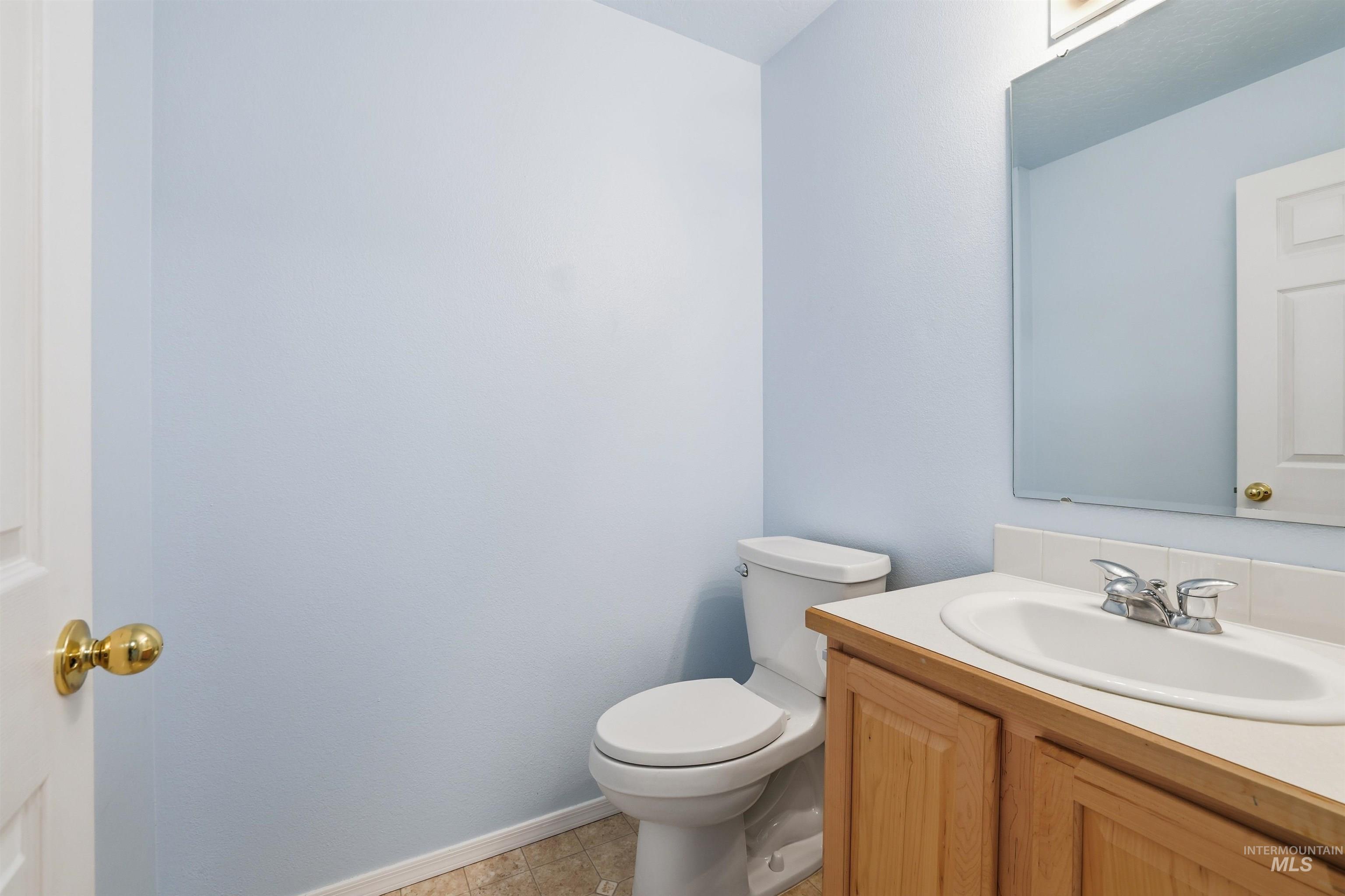 Bathroom featuring vanity and light tile patterned floors