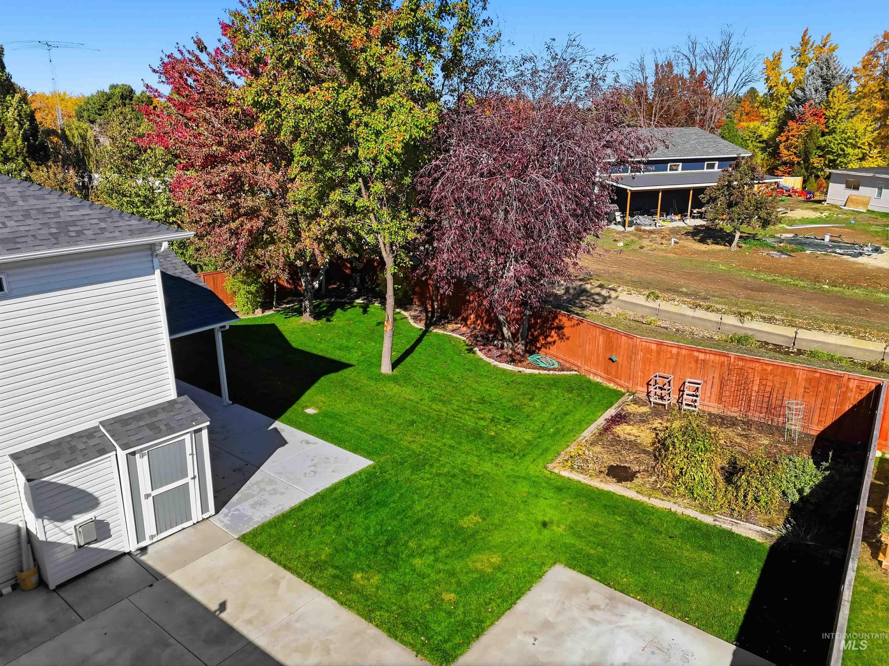 View of fenced backyard