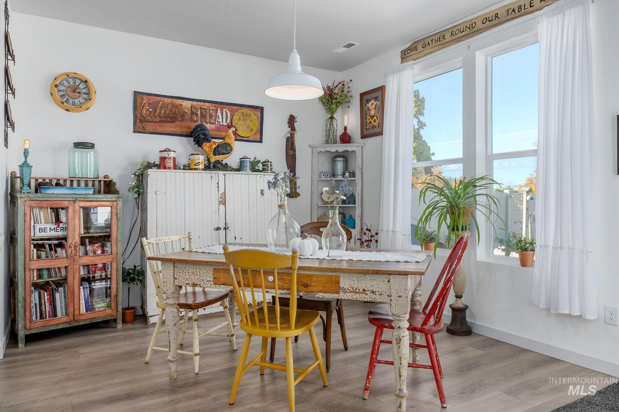 Dining space featuring light wood finished floors and baseboards