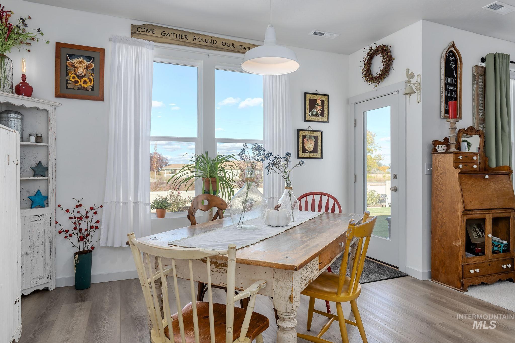 Dining area featuring light wood-style flooring