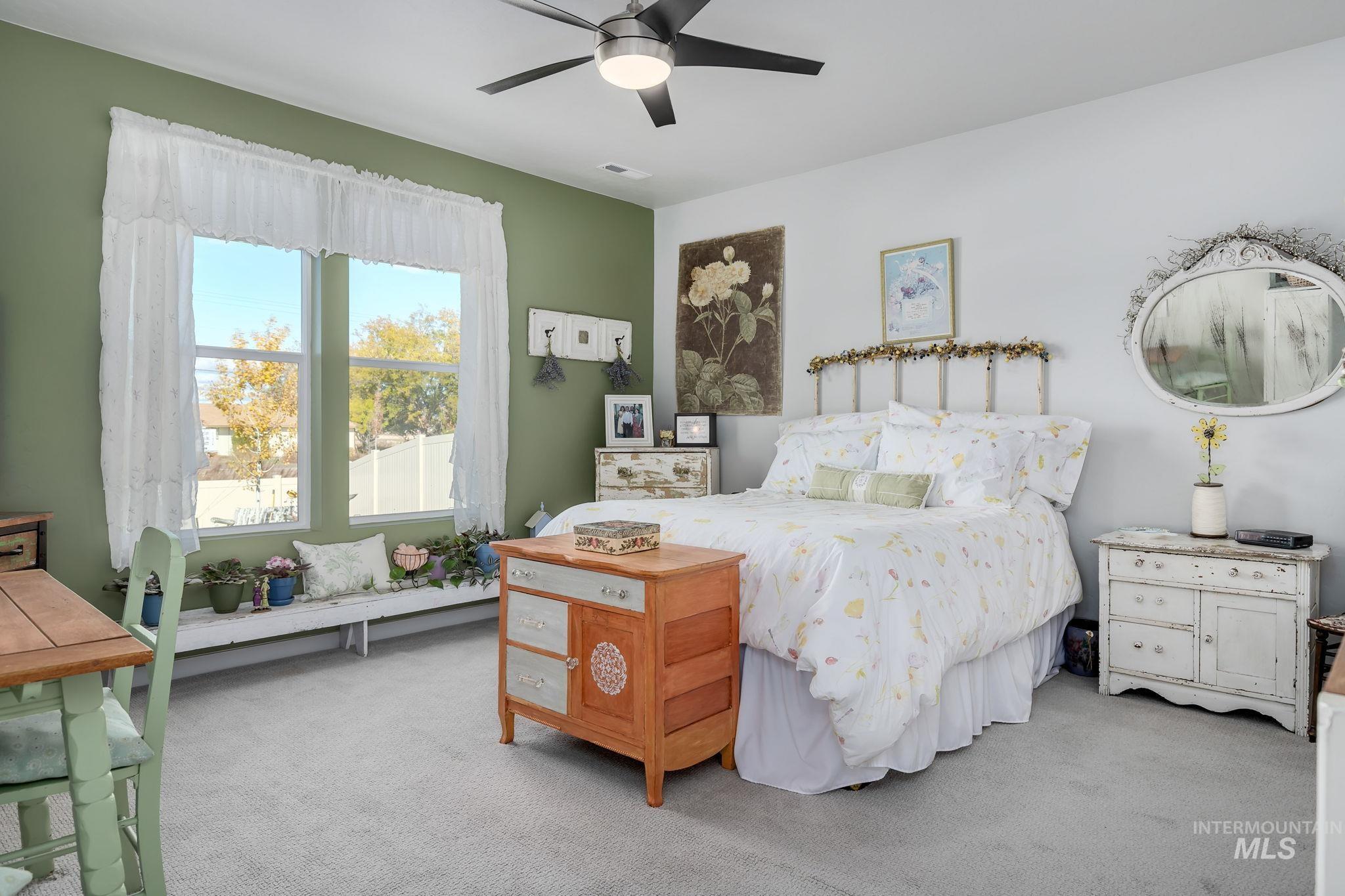 Bedroom featuring carpet flooring and ceiling fan