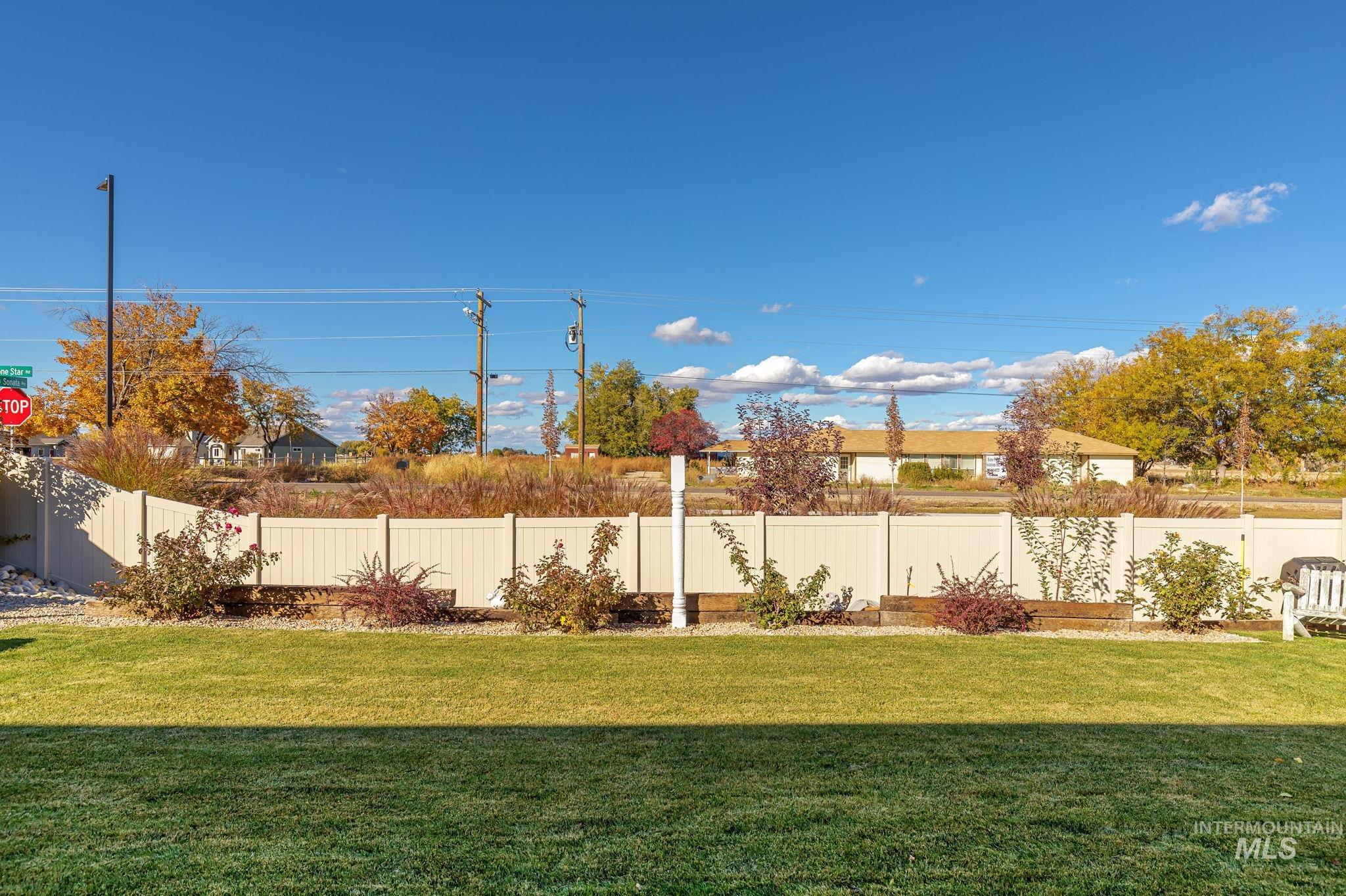 View of fenced backyard