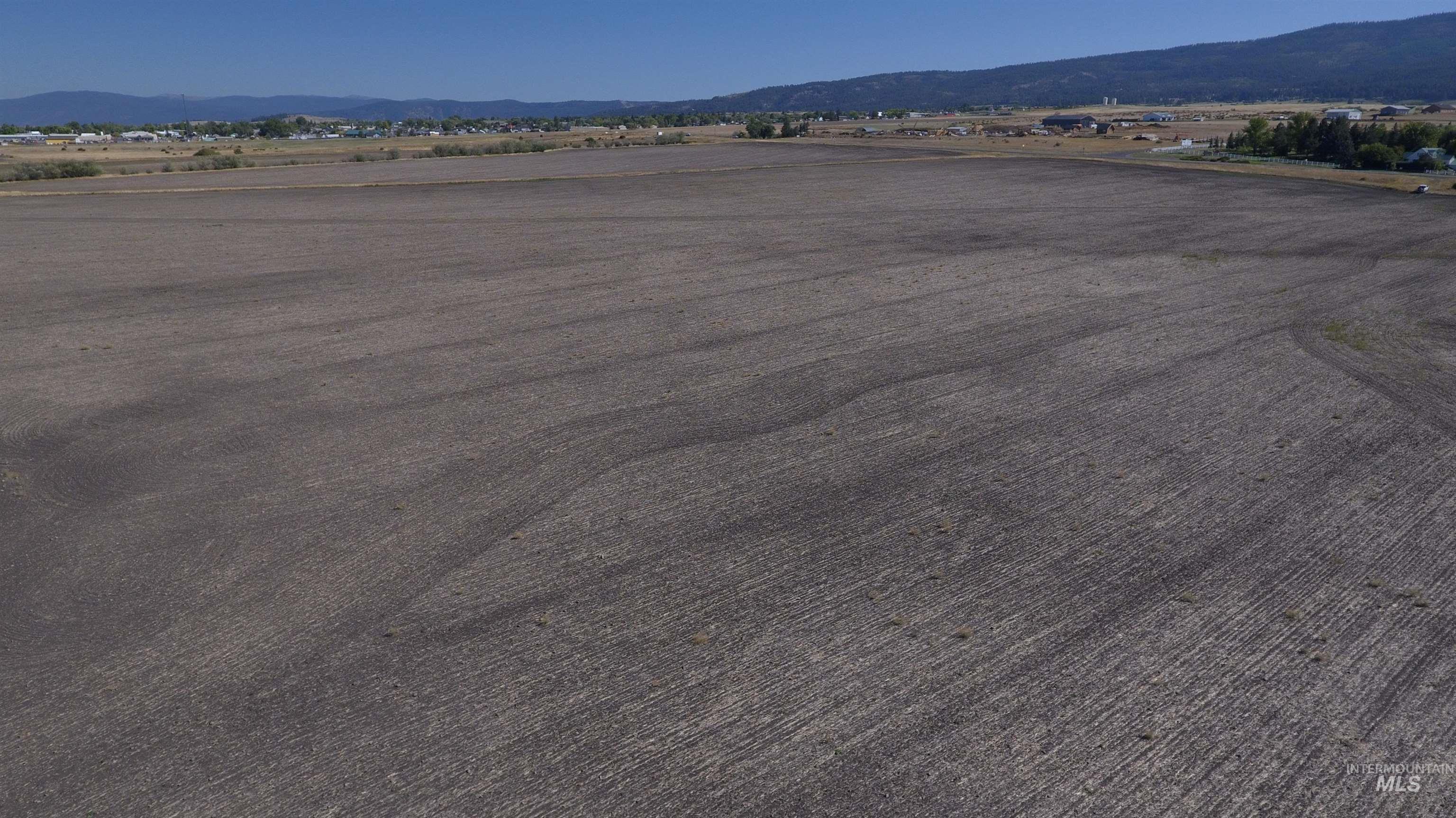 Aerial view of sparsely populated area featuring a mountainous background