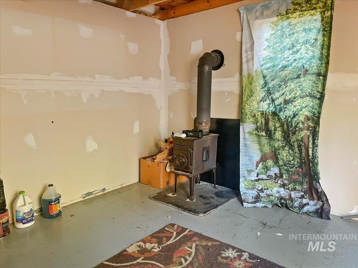 Below grade area with a wood stove