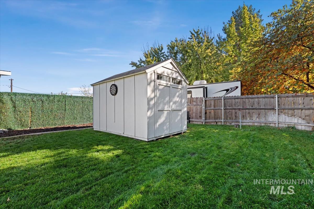 View of shed featuring a fenced backyard