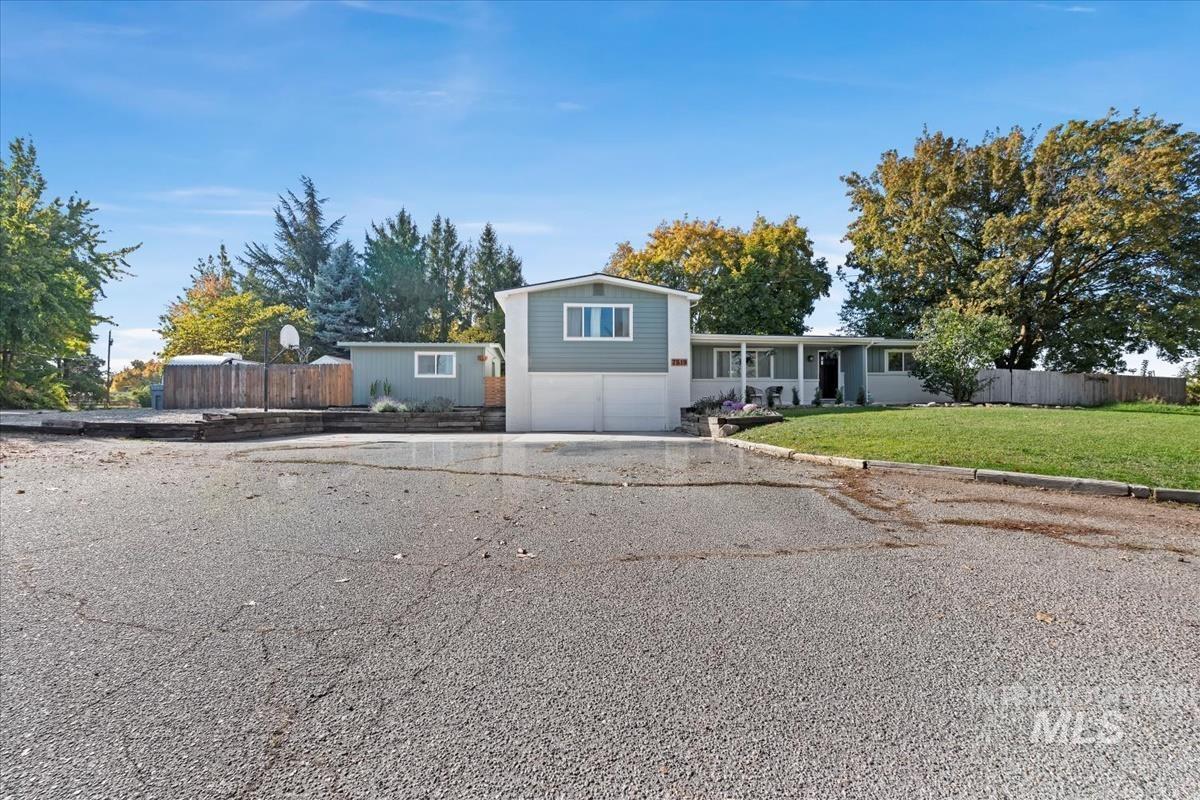 Tri-level home with a garage and driveway