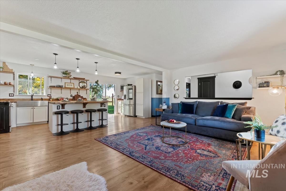 Living area featuring light wood-style floors