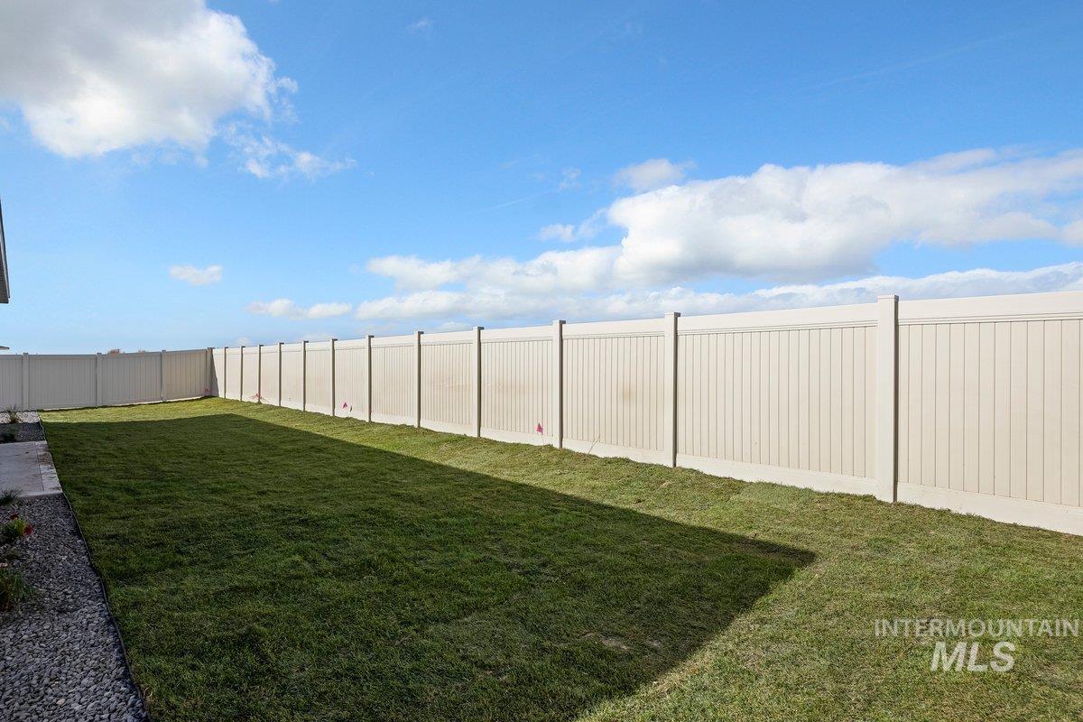 View of fenced backyard