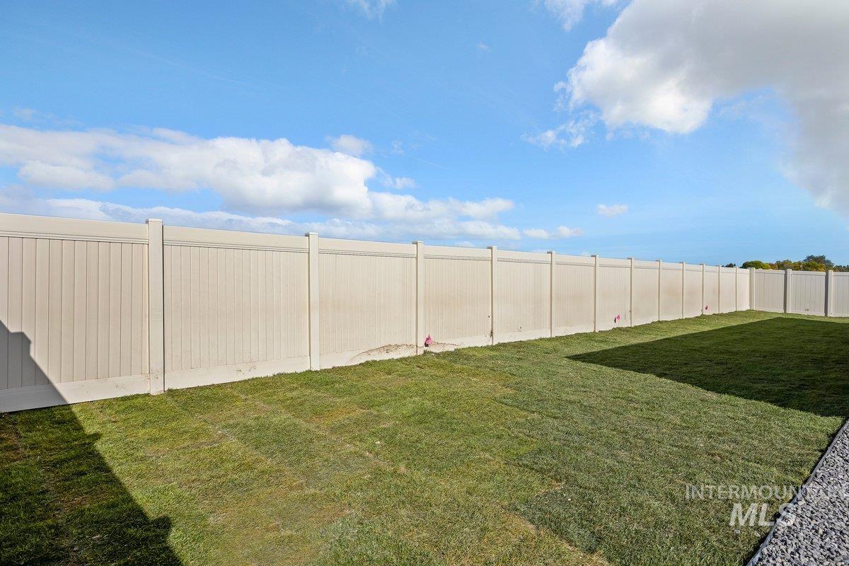 View of fenced backyard