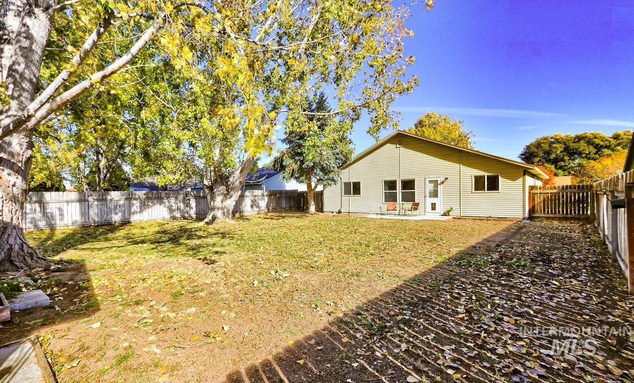 Fenced backyard with a patio area
