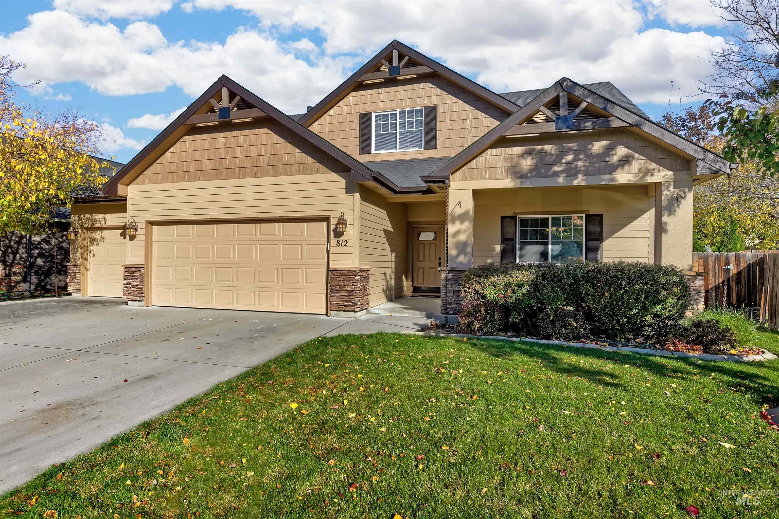 Craftsman inspired home with concrete driveway and an attached garage