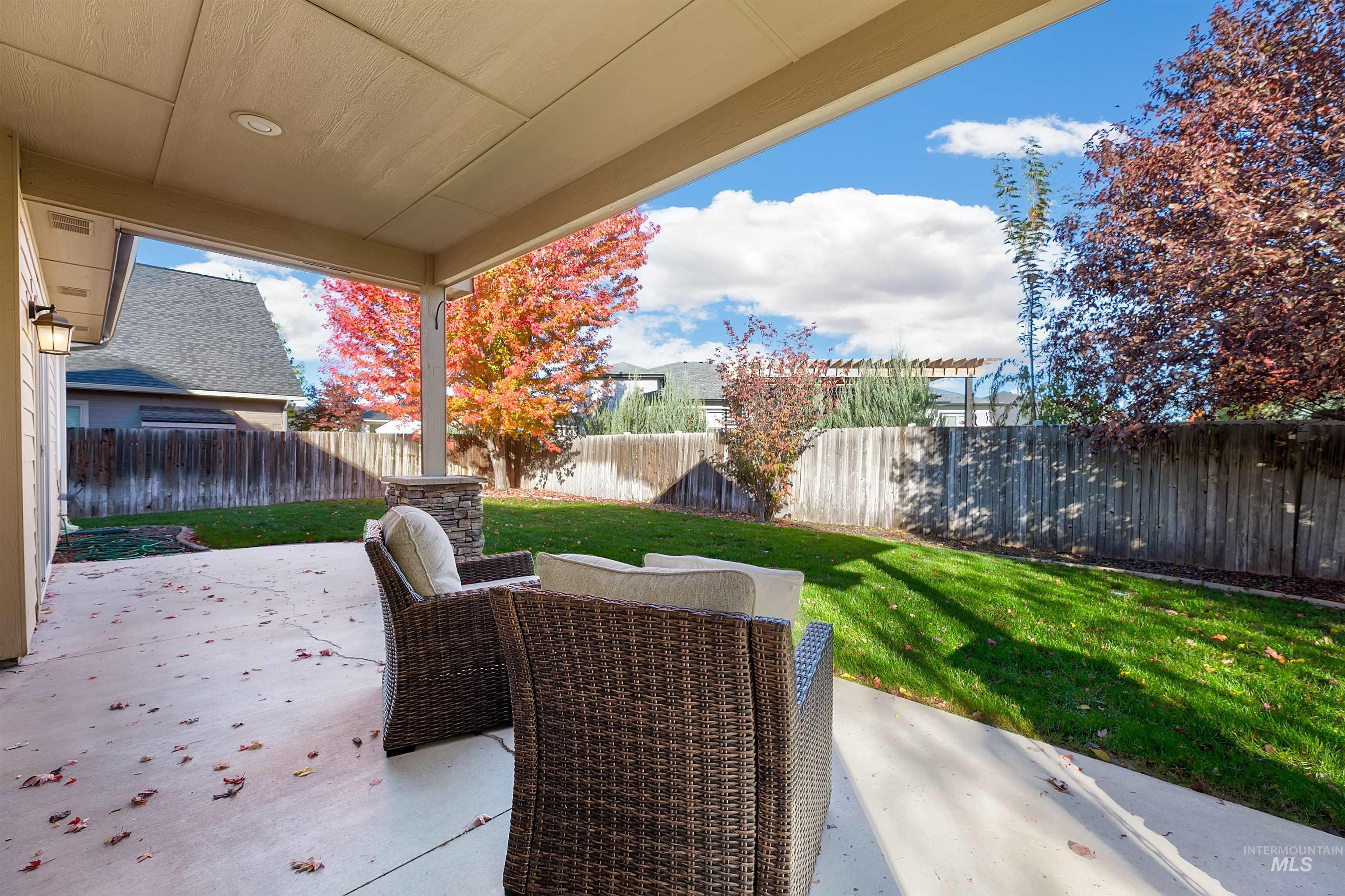 Fenced backyard featuring a patio