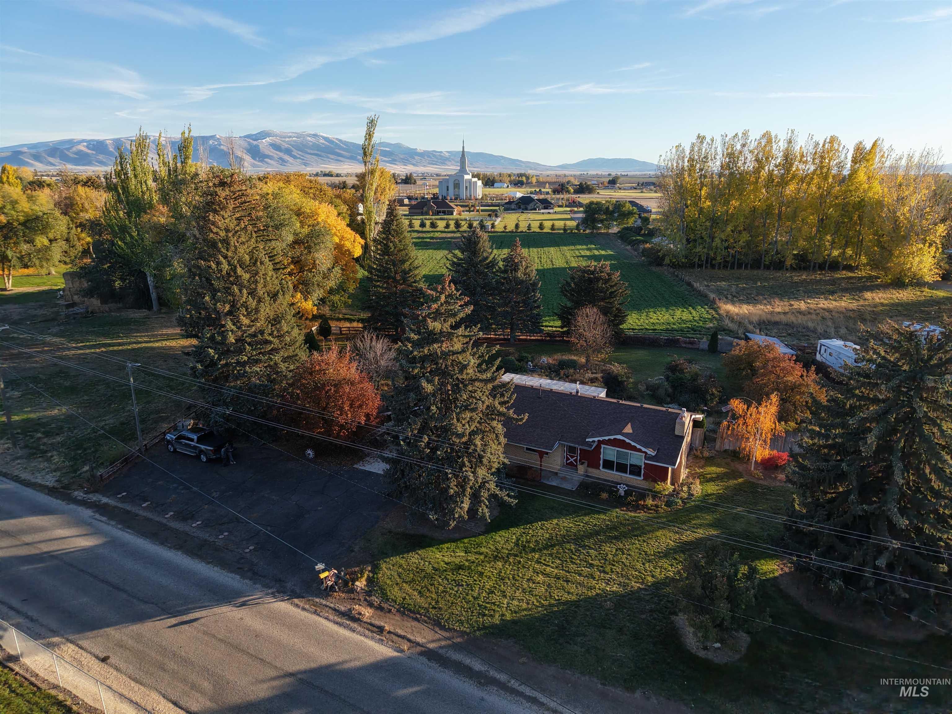 Overview of rural landscape with a mountain backdrop and abundant farmland