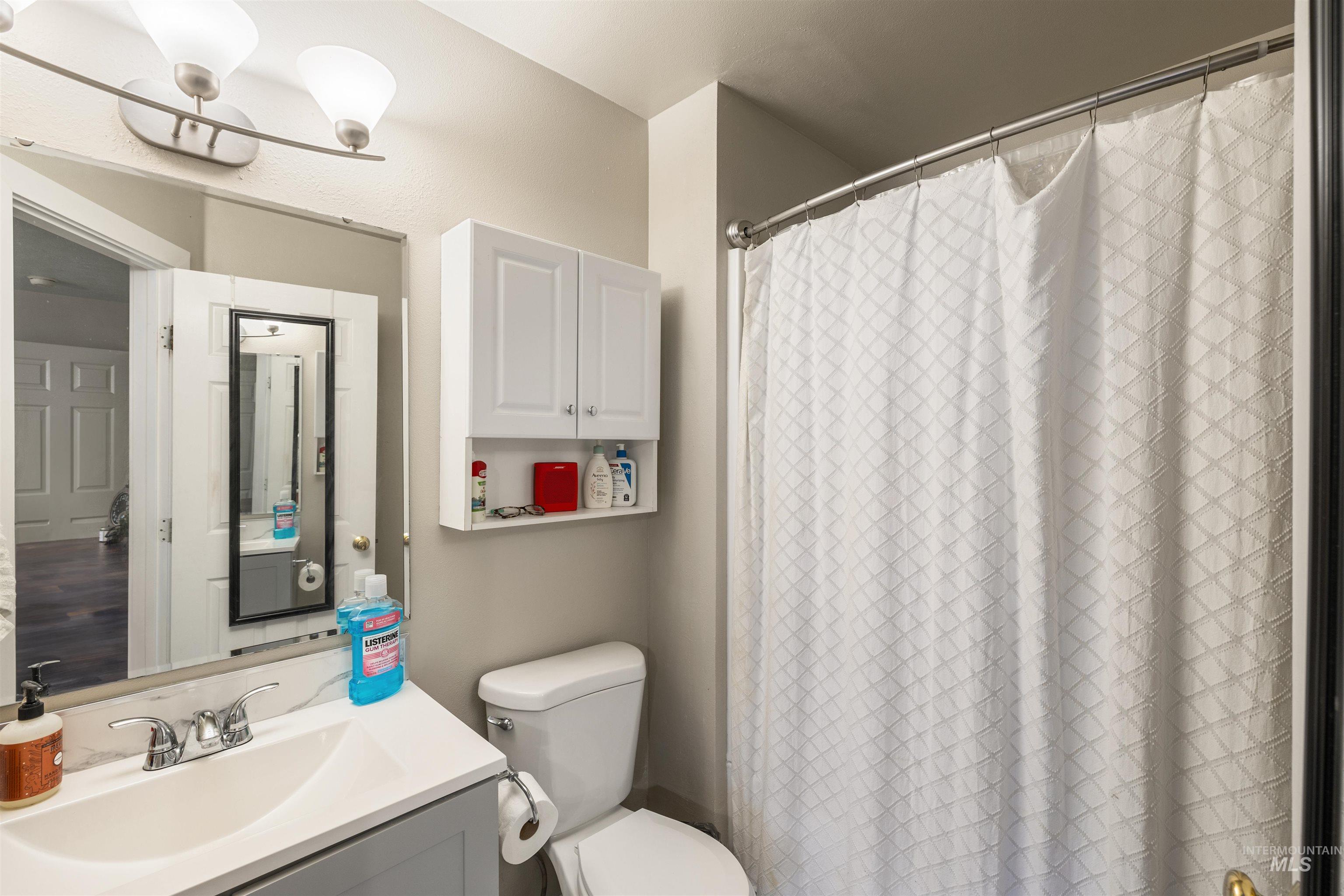 Bathroom featuring vanity and a shower with curtain