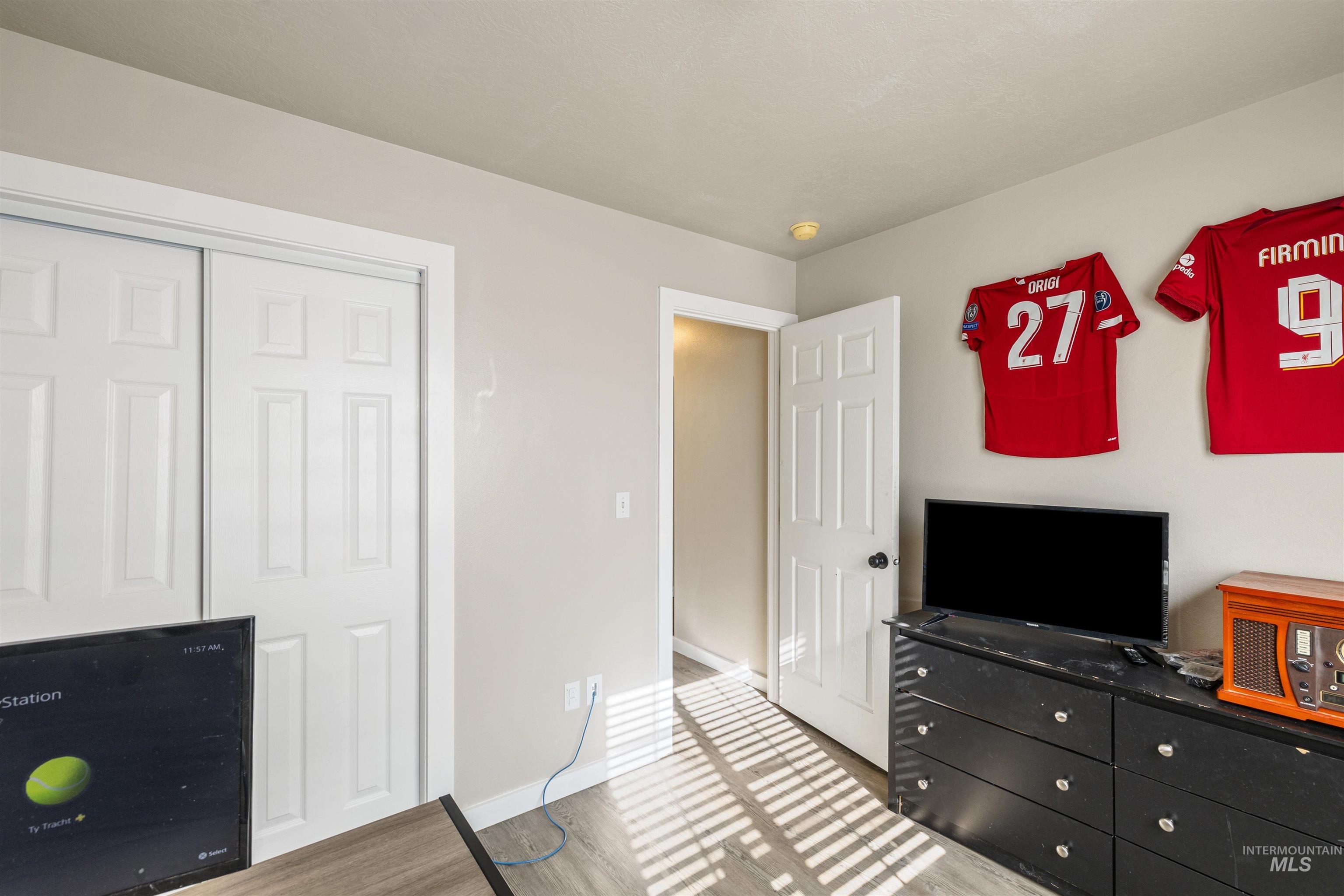 Bedroom featuring a closet and wood finished floors