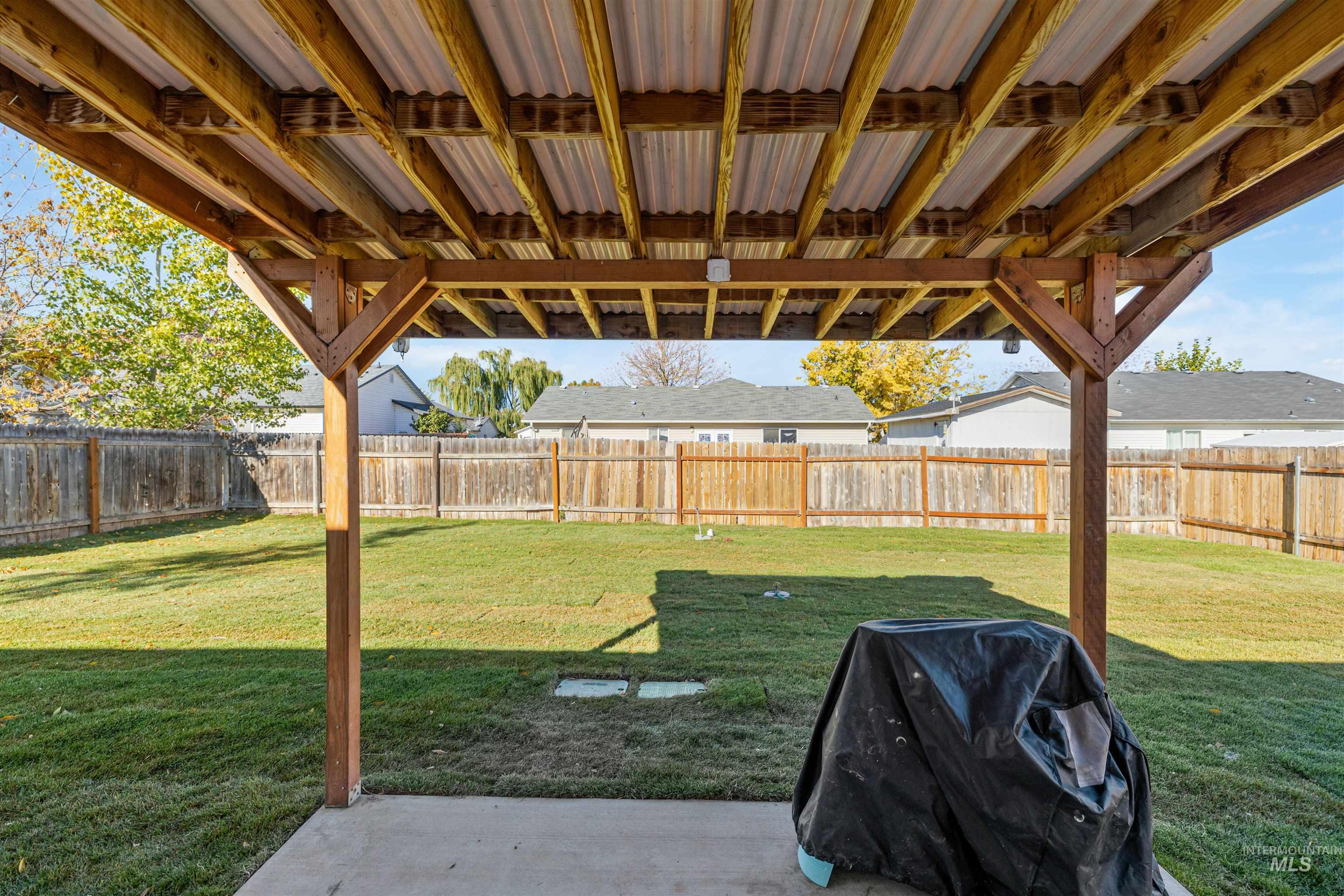 Fenced backyard featuring a patio area