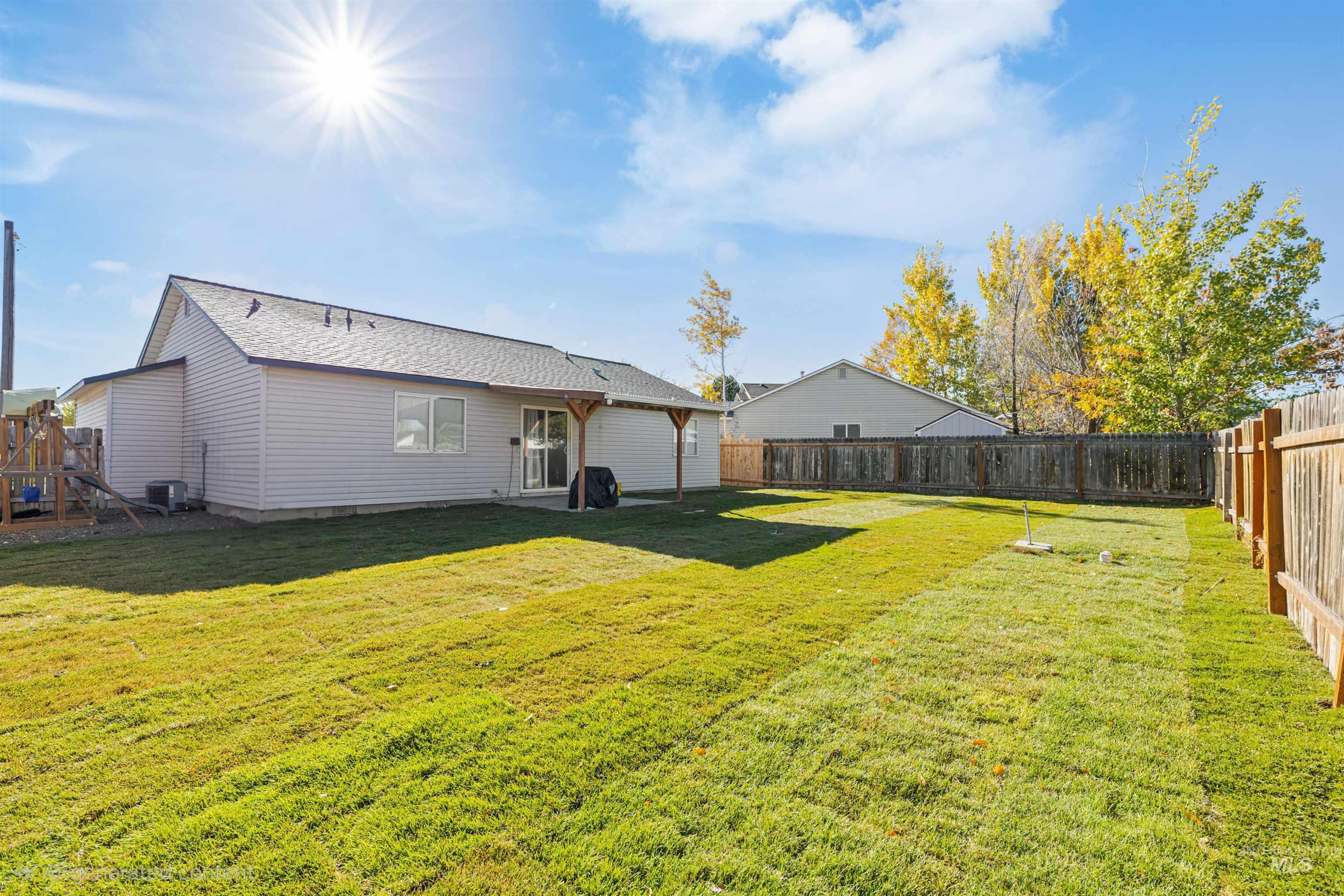 Rear view of property with a fenced backyard, a patio area, a playground, and roof with shingles