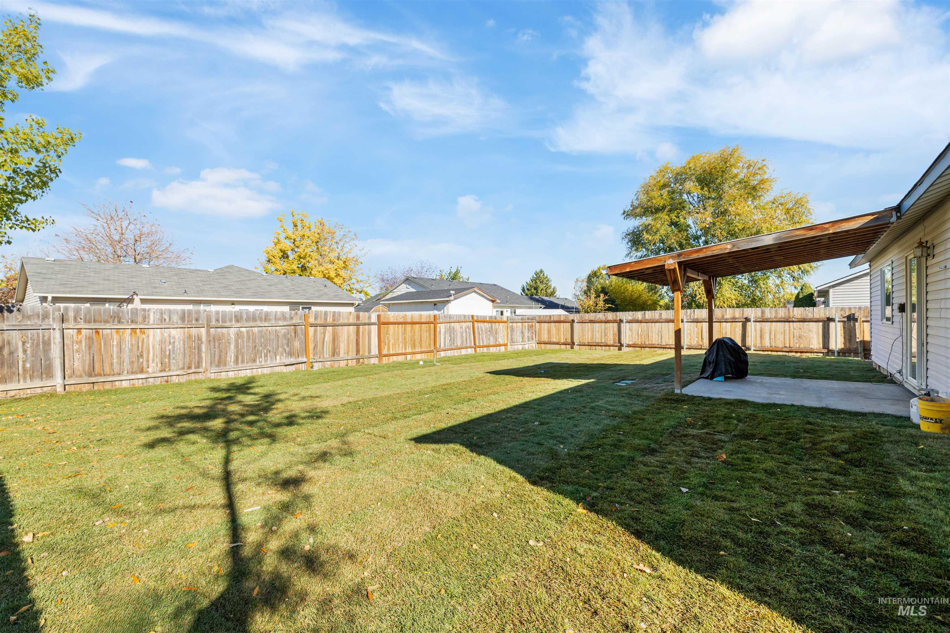 Fenced backyard featuring a patio area