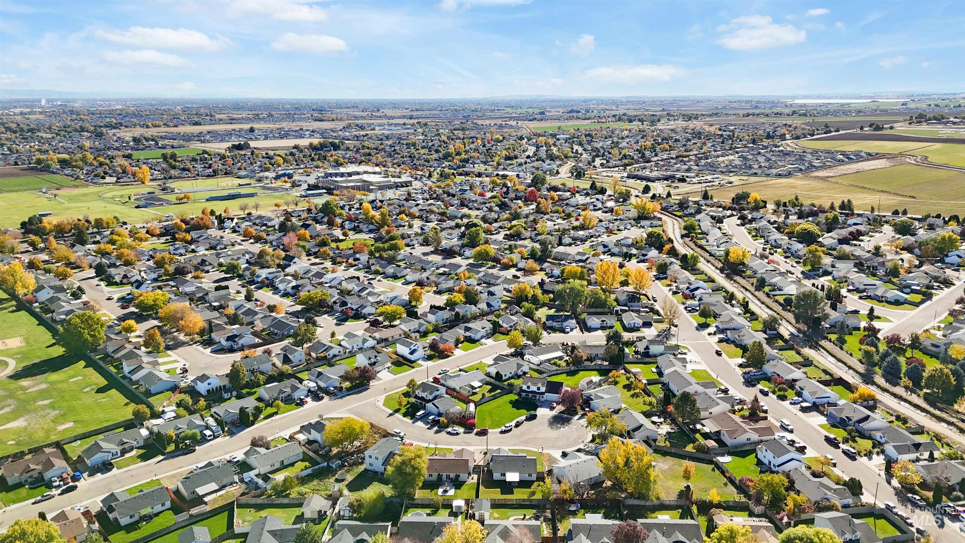 Aerial overview of property's location featuring nearby suburban area