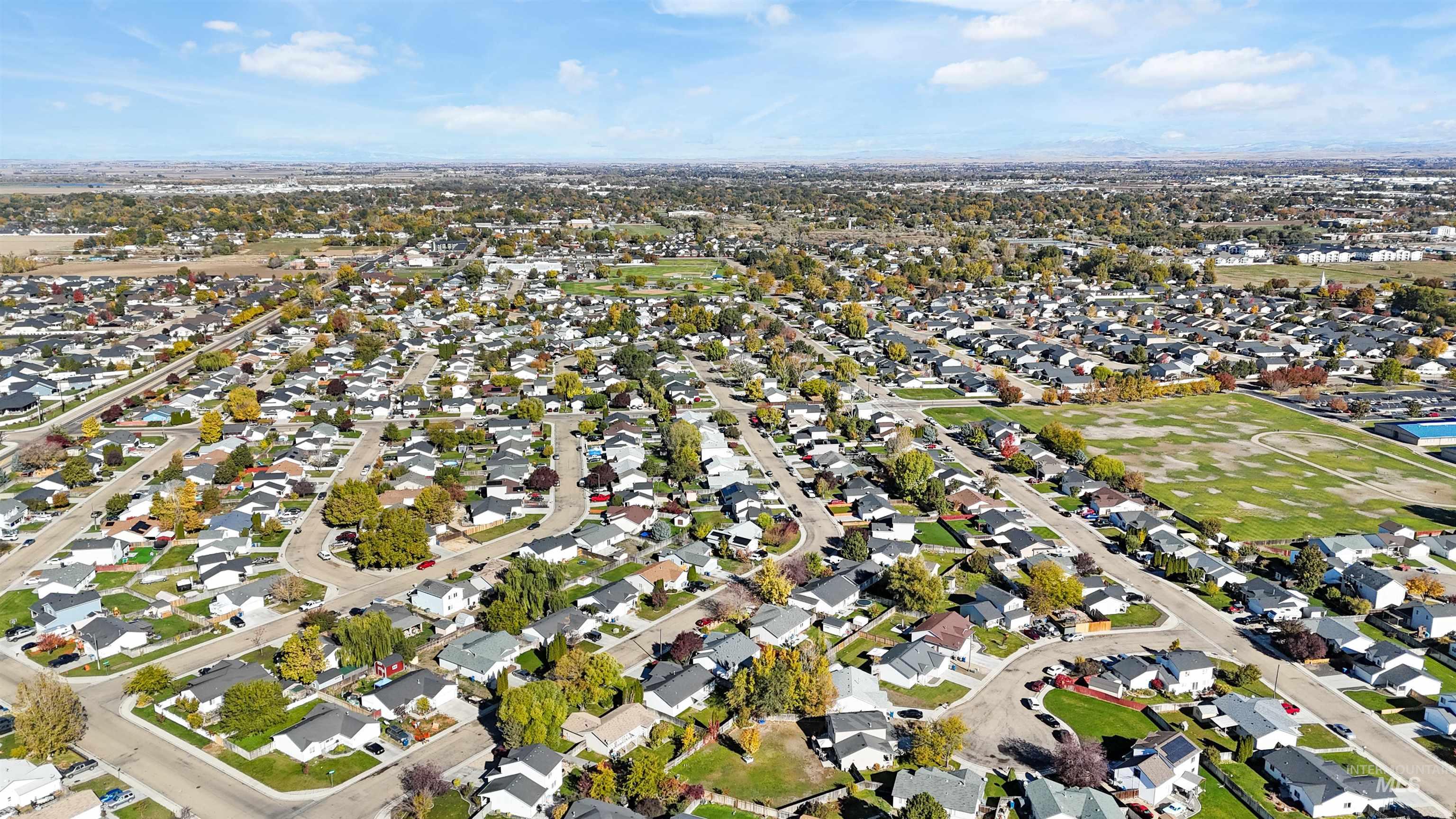 Aerial overview of property's location with nearby suburban area
