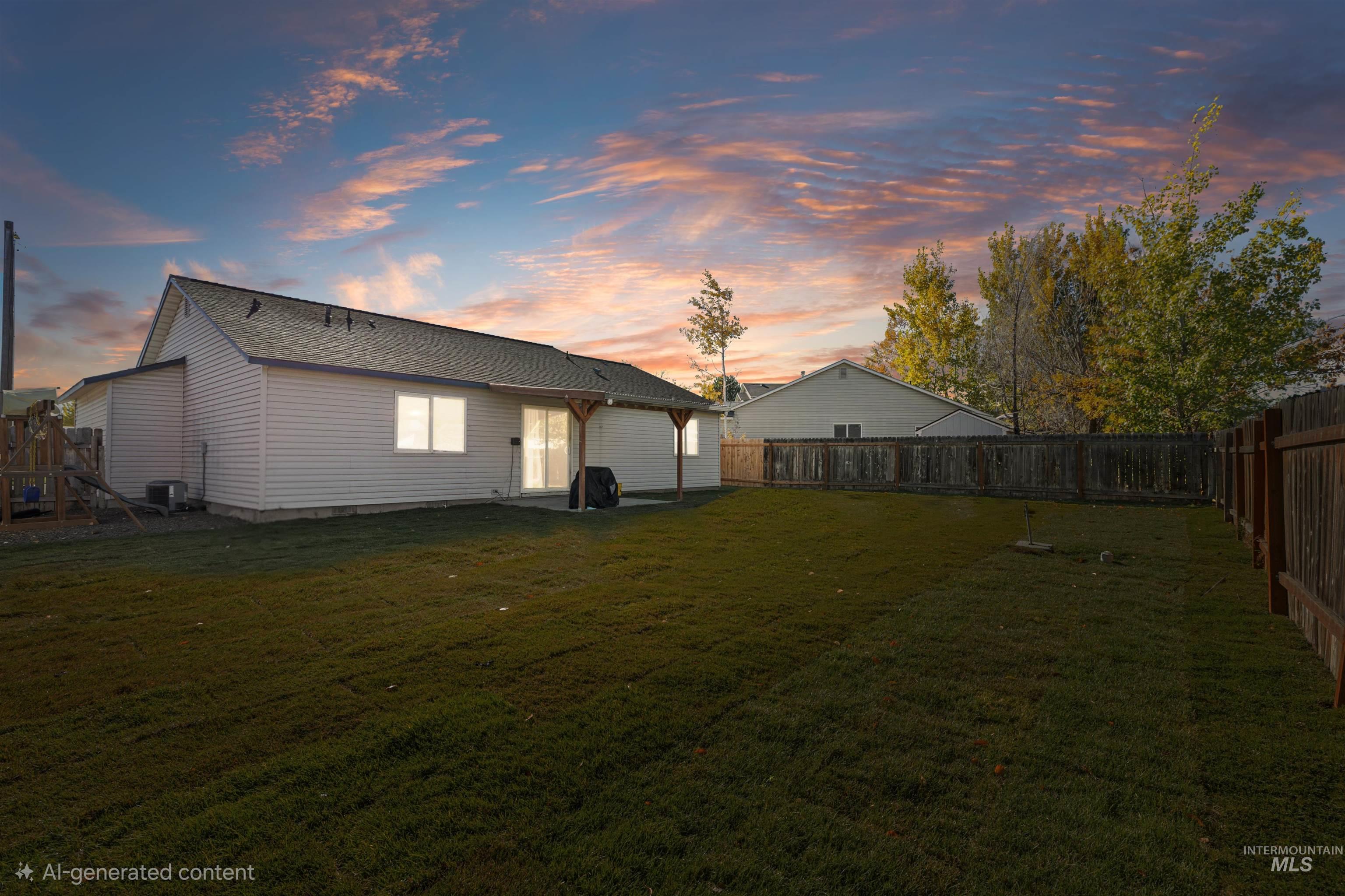 Back of house featuring a fenced backyard and a patio