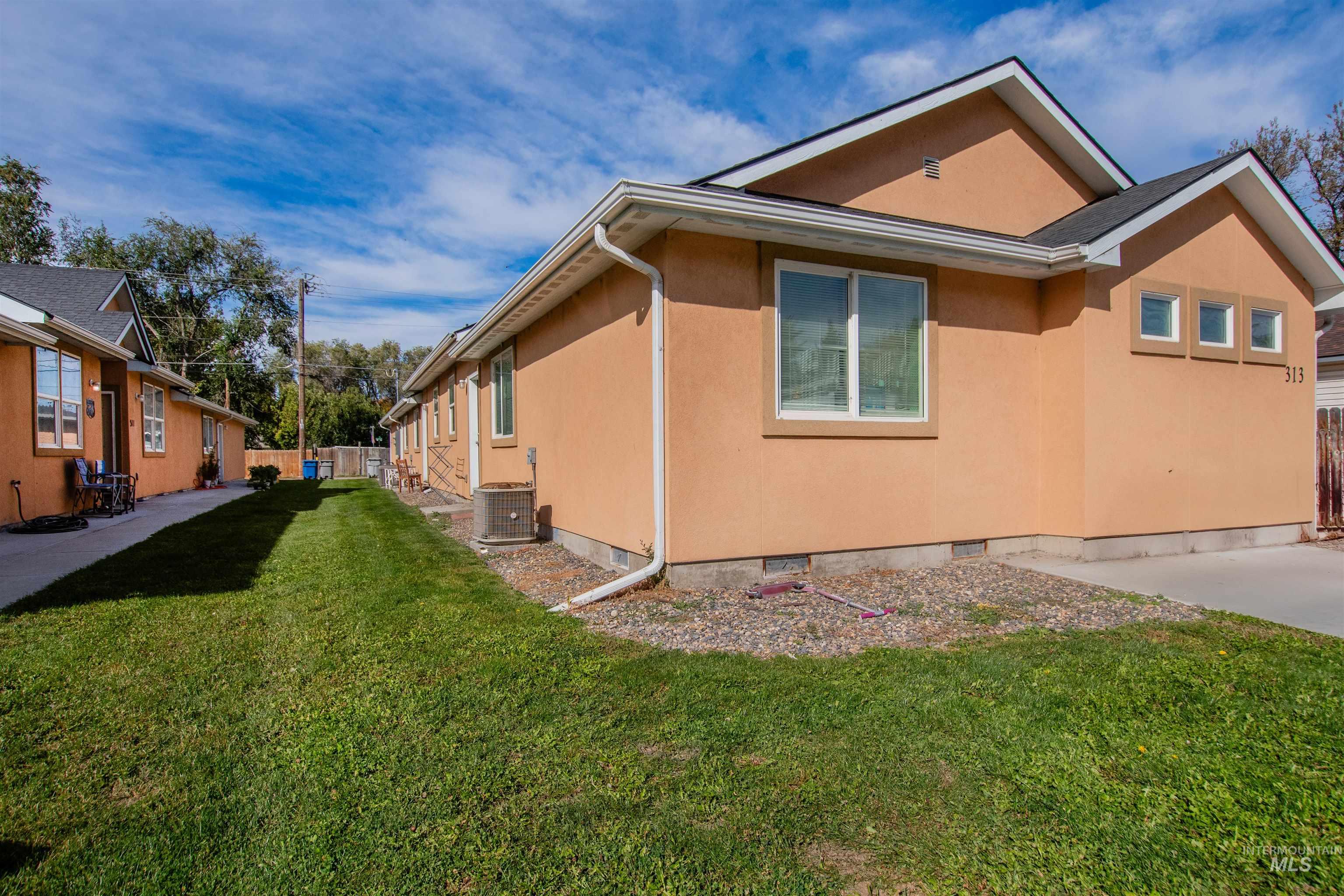 View of property exterior featuring stucco siding and a central air condition unit