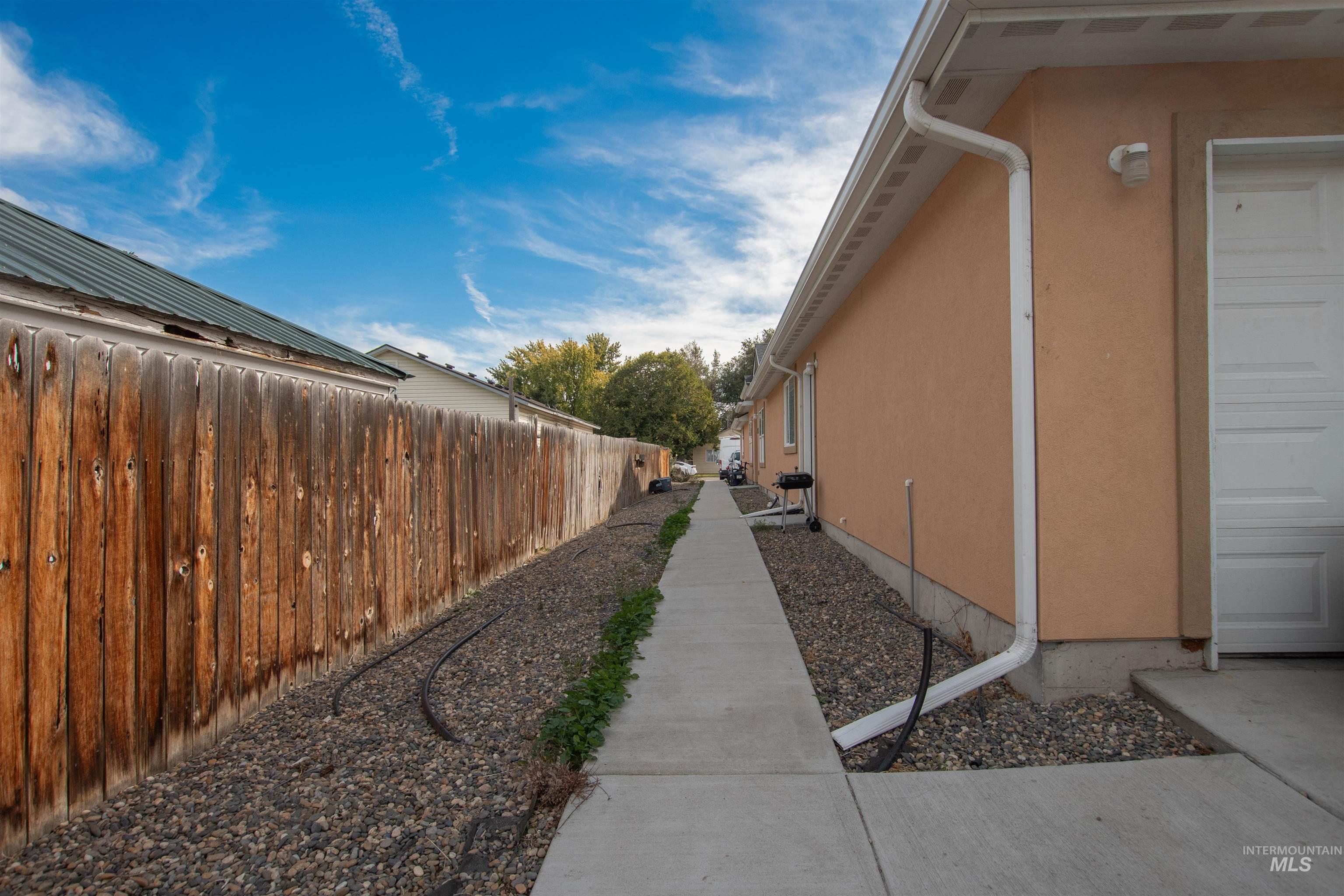View of side of home featuring stucco siding