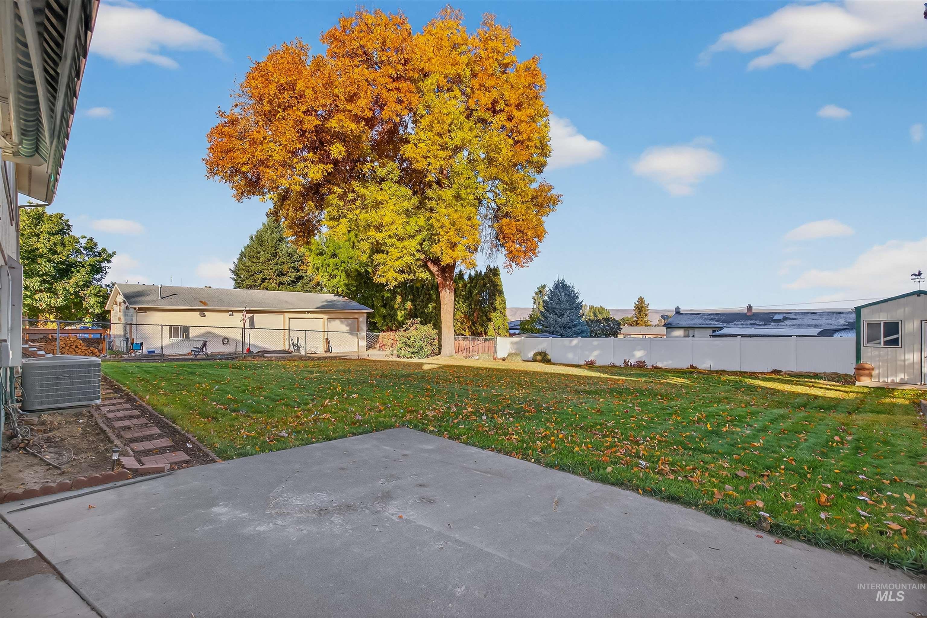 Fenced backyard with a patio