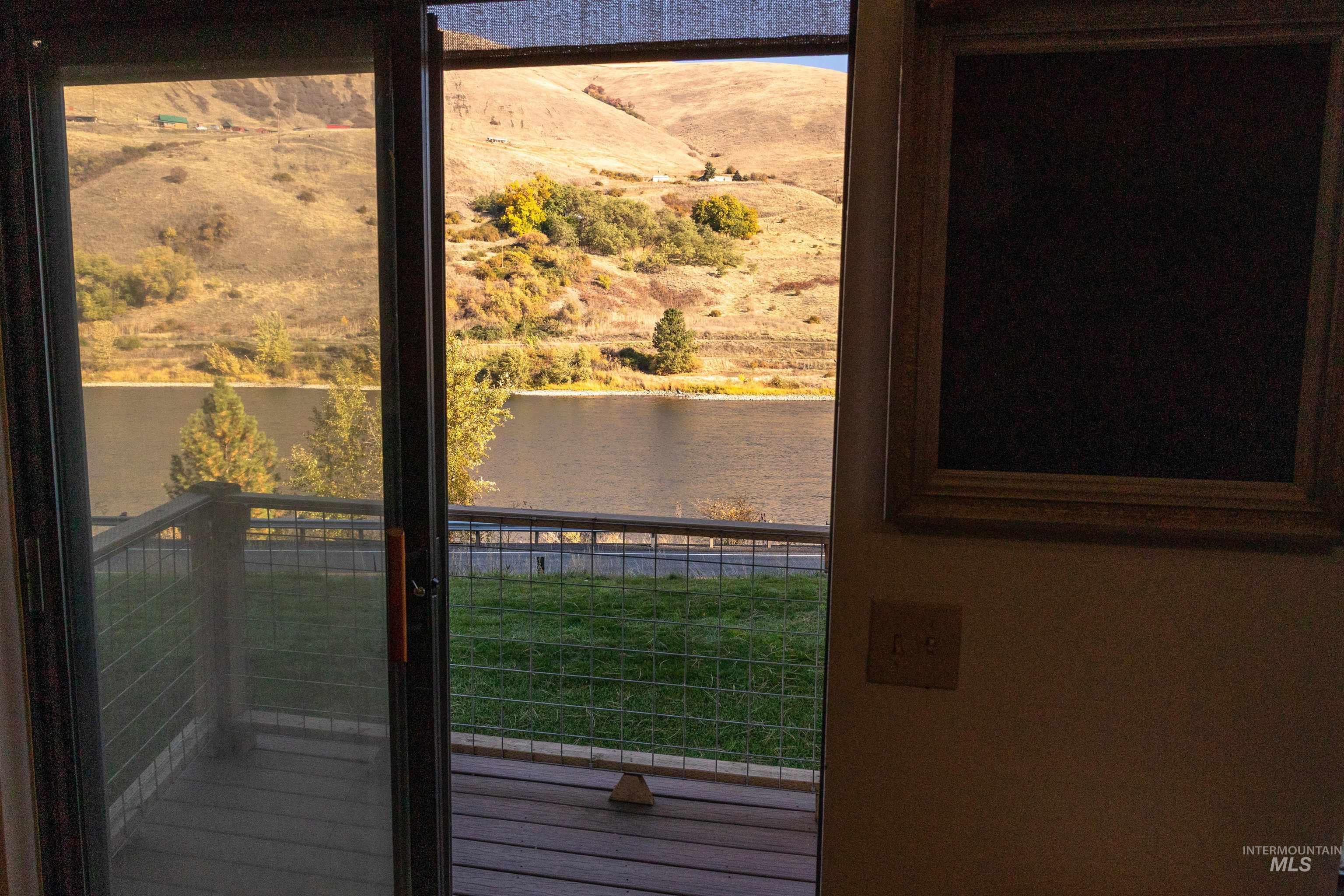 Doorway featuring a water view
